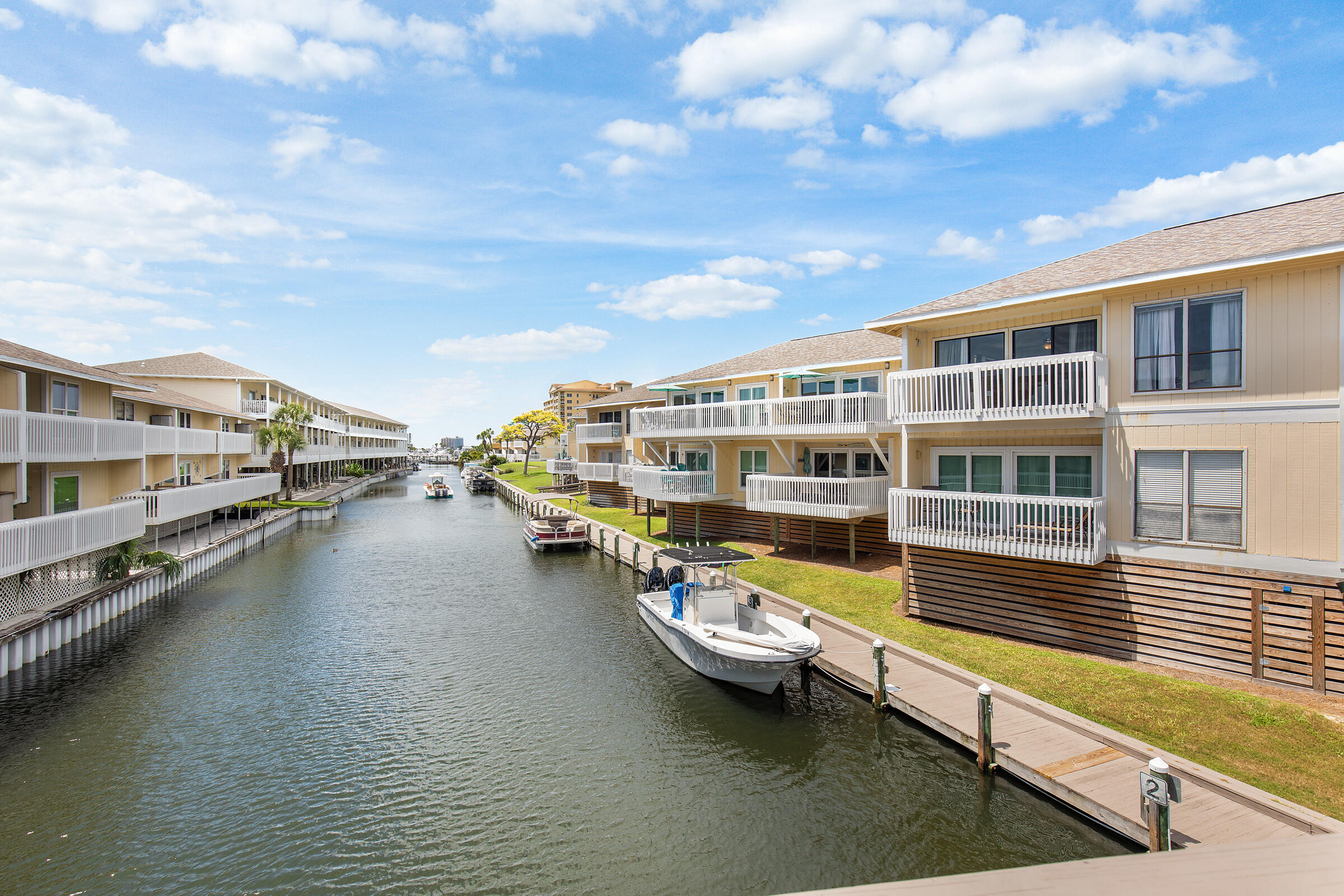 This beautifully updated condo is ready for your next getaway or rental investment. Two new bunk beds increase the sleeping capacity from 4 to 6, perfect for family and guests. Enjoy the evening sunsets from the deck while watching the boats cruise the canal. Recent updates include new laminate flooring & fresh paint, smart TVs in living and bedroom, memory foam mattress in bedroom, and washer/dryer. Located within Sandpiper Cove (SPC) a gated, low density resort community in the heart of Destin, you'll have access to 1,100 feet of private beachfront with seasonal beach service. Amenities include 5 pools & 6 tennis courts, 9-hole par 3 golf course, Canal docking & marina slip leasing, pickle ball & grilling areas, on-site dining. This is a great opportunity to own a canal front condo!