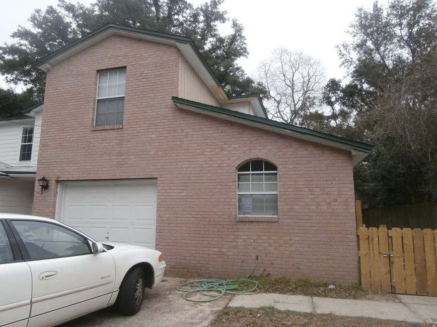 This end unit is fenced. It has been completely redone inside and out. It has been redone including new bathroom cultured marble counter tops, toilets, carpet, blinds,paint inside and out. Roof. It is a huge kitchen. It has a fireplace. Master bedroom and large bath is downstairs. It has side by side frig, stove, new dishwasher, washer and dryer. It has huge oversized bedrooms upstairs. Move in ready. Call now for your appointment you will not be disappointed as it looks like a brand new town home.