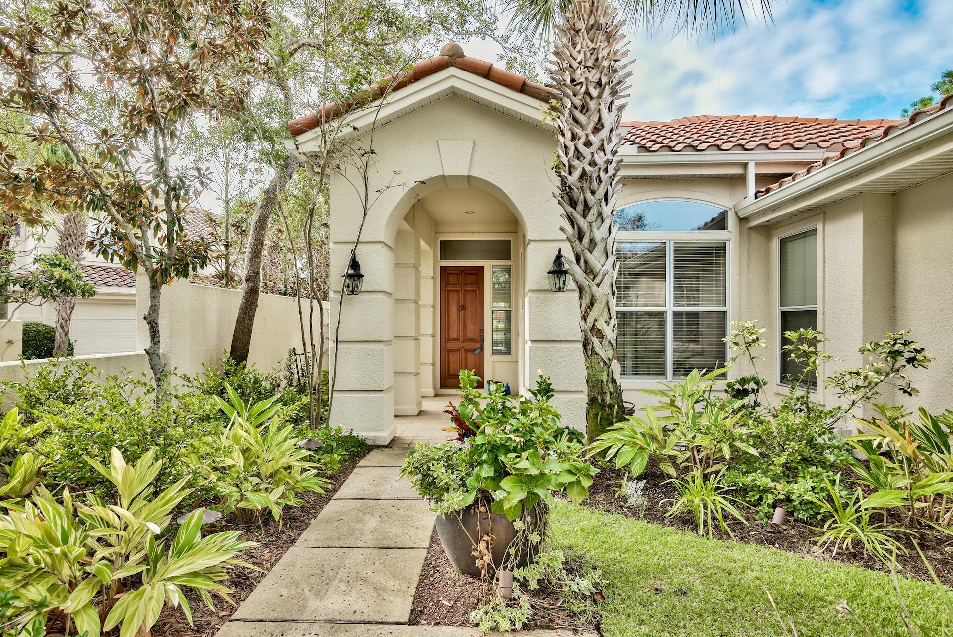 Everything you could ask for Single level, double garage, lake and golf course views. This beautiful home is accessed via a private gated courtyard and enters into the spacious open floor plan with plenty of room including a large enclosed patio. The great room has a gas fireplace, built in cabinets, and vaulted ceiling. A top of the line kitchen offers granite counter tops, breakfast bar, custom cabinetry and stainless steel appliances including a gas stove. Split floor plan allows privacy for the master bedroom suite featuring walk in closet, separate shower and double vanity. The third bedroom is versatile and can also function as an office. Lots of space for all your stuff in the extended storage area within the double garage, as well as a full size laundry room.