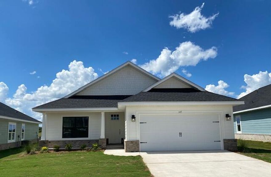 20 minutes from Blue Mountain Beach!  Flood Zone X.  Open concept, 3 bedroom, 2 bath plan with LVP flooring throughout. Home features minimum 9' ceiling height with trey in M. Bedroom and soaring ceiling in living room.  8' entry doors, large rear covered patio, Master bedroom is 14 x 22.  Generous size master closet, separate garden tub and shower, quartz counter tops, undermount sinks, lever-handled doors, sprinkler system with well & pump, fully sodded yard, pull-down attic stairs, garage opener.