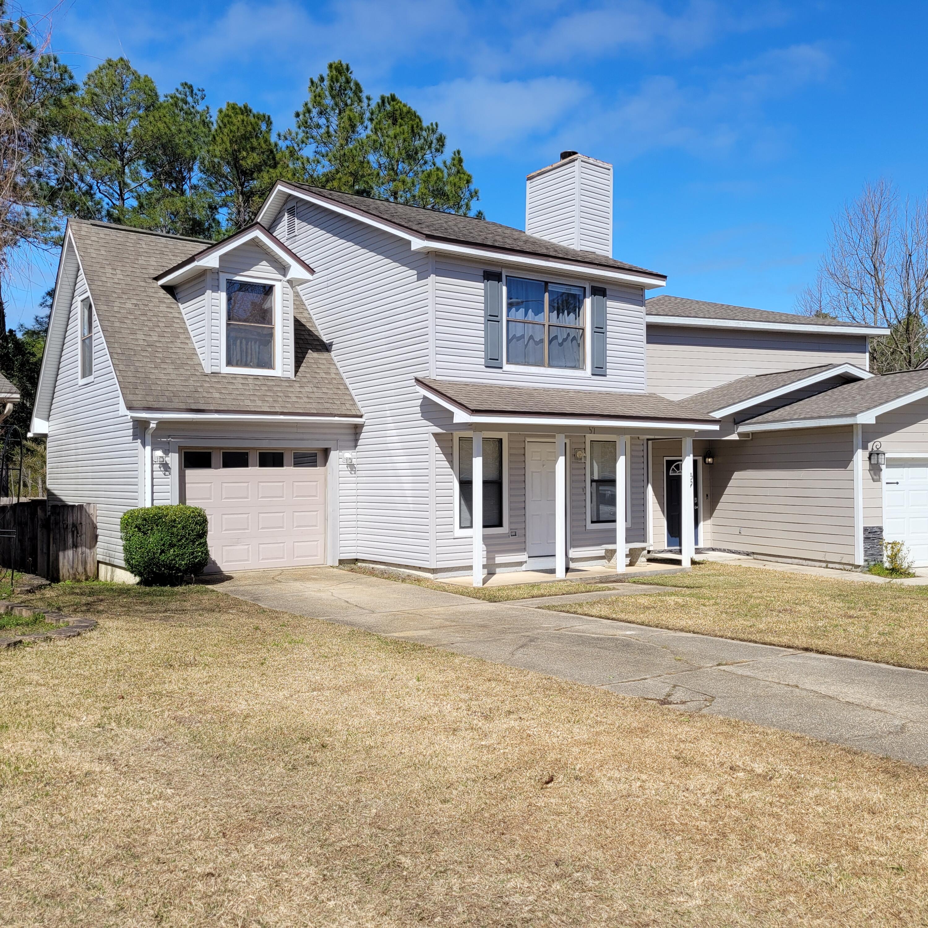 Cute home backs to a pond for privacy and it's convenient to Eglin AFB, Twin Cities Hospital, NW Florida State College and the FT Walton Beach Airport.  Just a short drive to the beautiful beaches of Okaloosa Island and Destin.  Living room features a pretty stone fireplace and hardwood flooring.  Open kitchen and dining area with cased opening to the living room for a spacious feeling.  The guest bath with barn door is easily accessible from the backyard.  Enjoy outdoor living with a 15x7.9 screened porch and an open 12x8 deck perfect for grilling.  Relax and enjoy the view from the large master balcony overlooking the pond.   It's getting hard to find a home in this area under $300,000.  What are you waiting for, come see it today.  Home is ready for quick occupancy.