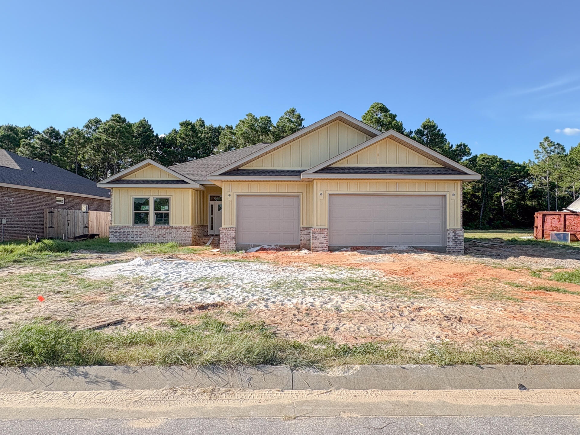 ***Under construction! Estimated completion Aug/Sept 2025.*** Affordable & luxurious new construction home in Gulf Breeze! 4 bed/3 bath with triple split floor plan, wide open main living areas, 3 car garage, & covered front & back porches. Premium features throughout including exotic granite countertops in kitchen & all baths, white cabinets with contrasting espresso brown island in kitchen, stainless steel appliances including gas range & beverage cooler, walk-in tile shower & freestanding tub in master bath. All LED lighting, ceiling fans in living & all bedrooms, tankless gas water heater, & Trane composite HVAC system. Outdoor living is made easy with the spacious covered porch & large backyard with sod & irrigation on well included. Truly a must see! Photos current as of 7/14/202