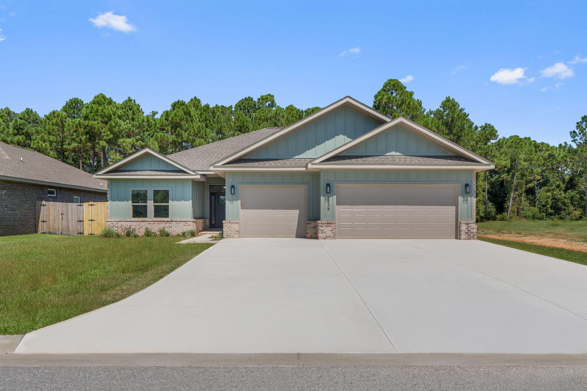 Affordable & luxurious new construction home in Gulf Breeze! 4 bed/3 bath with triple split floor plan, wide open main living areas, 3 car garage, & covered front & back porches. Premium features throughout including exotic granite countertops in kitchen & all baths, white cabinets with contrasting espresso brown island in kitchen, stainless steel appliances including gas range & beverage cooler, walk-in tile shower & freestanding tub in master bath. All LED lighting, ceiling fans in living & all bedrooms, tankless gas water heater, & Trane composite HVAC system. Outdoor living is made easy with the spacious covered porch & large backyard with sod & irrigation on well included. Truly a must see!