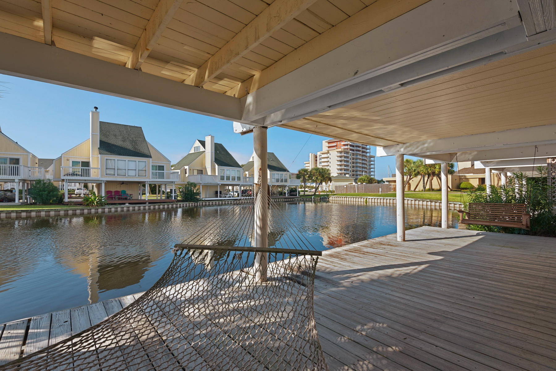 1st COTTAGE on the LAKE to be listed since November 2016!!!Enjoy the sunrise on your 2nd floor eastern facing deck while listening to the combined soothing sounds of the water fountain and mother nature. When the paintbrush comes out to paint the skies with the many colors of the sunset, enjoy them from your 2nd floor western deck looking towards Destin Harbor. How about grilling with your personal grill and enjoying the family as a group? That is possible on the ground floor that runs the full length of the cottage on your beautiful lake!