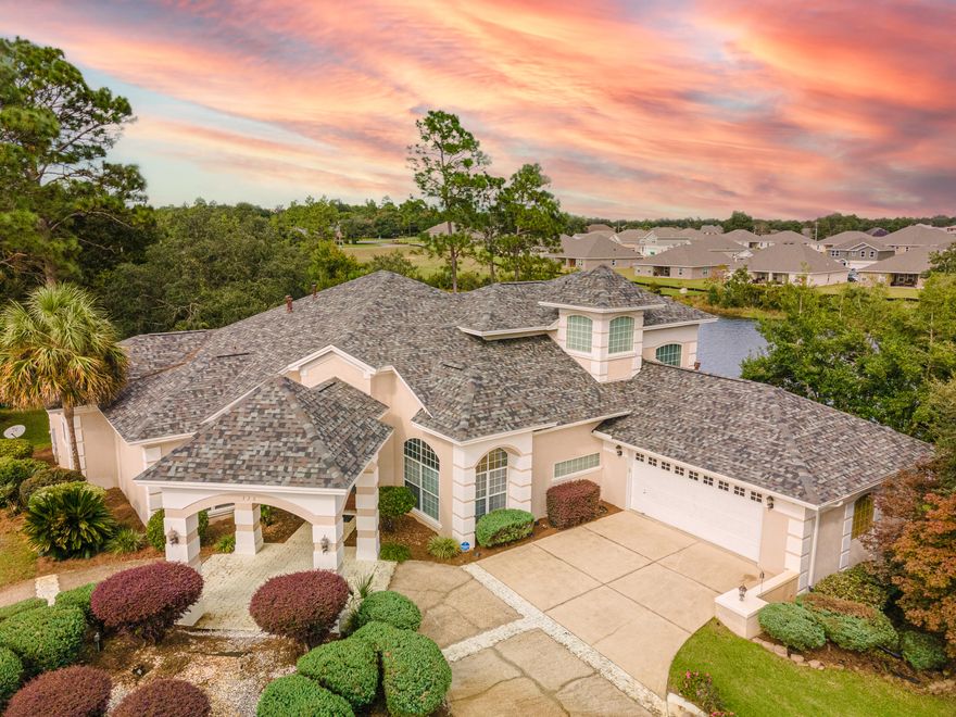 Stunning South Crestview water view home with circular driveway, manicured yard and front Portico all invite you into this 2 story, 4 bedroom 3.5 bath oasis. Florida Room, wet bar, high ceilings, large windows, and intricate details throughout.  Primary bedroom on main level with circular tray ceiling, whirlpool tub, granite countertops and large walk in closets.  Tile flooring throughout the main area, open concept kitchen and a floor plan that is great for entertaining!  Large doors open to the screen covered, in-ground pool and hot tub. Perfectly nestled on .51 acres at the end of a cul-de-sac.  Enjoy fishing off the dock in the beautiful backyard.  This home is truly one of a kind!  Call today to schedule your showing! Home is being sold 'As is' Seller is open to entertaining all offers.