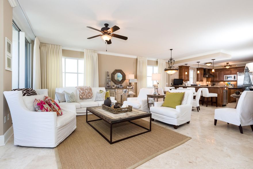 Bella Riva the Beautiful! Your Luxurious Mediterranean inspired beach front condominium awaits you! Unit 209 (3rd floor unit) is the largest floor plan in the building boasting 3 bedroom, 3 bath, media room, a huge 440sq ft. terrace w/ gas connection and hurricane shutters for your peace of mind. This upscale condo is professionally decorated w/ upgrades including travertine stone tile throughout except in the bedrooms (carpet), crown molding, granite countertops, stainless steel Viking appliances, 6 burner gas cooktop, separate icemaker, flat screen tv's, Gulf front spa like master suite w/ his and her closets, relaxing tub, separate shower, separate vanities and balcony access. Additional bedrooms provide en-suites for your guest's convenience & privacy. Amenities include, refres