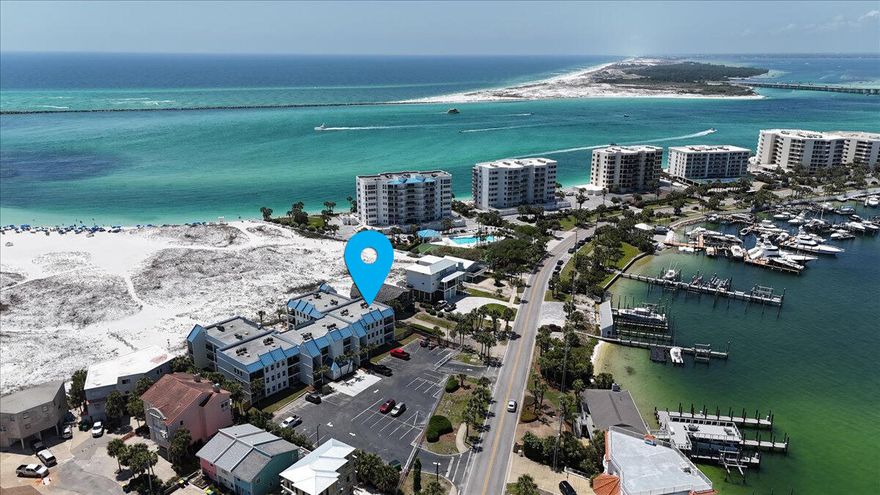 Wake up to the sound of waves and end your day with a sunset over the Gulf--welcome to Unit 308 at Poolside Villas. This fully furnished 2-bedroom, 2-bath corner-unit condo on Destin's Holiday Isle offers water views on three sides: the Gulf, East Pass, and Destin Harbor. With a private balcony, updated interior, and easy beach access, this corner unit is perfect as a personal getaway or a vacation rental. The building has just completed a $2 million renovation--fully paid and move-in ready with no special assessments! The space is updated, comfortable, and totally turnkeycomplete with in-unit laundry, a fully equipped kitchen, and a bright, beachy feel throughout. With enough space to comfortably sleep up to 6 guests, it's ideal for families, couples, or small groups. Stay as often as you like, then rent it out when you're away. It's rental-ready with strong income potential.

Getting to the beach is a breezejust a short stroll from your door to the sugar-white sand and emerald waters. The building itself looks brand new! A $2 million structural and exterior renovation was just completed (fully paid, no assessments pending), so you can enjoy peace of mind along with the views. The 30-unit complex offers a large pool, two dedicated parking spots, and even a water taxi that takes you straight to Harborwalk Village. Located in Flood Zone Xno flood insurance required.

Contact the listing agent directly for the best deal, or contact your favorite buyer agent to schedule your showing today!