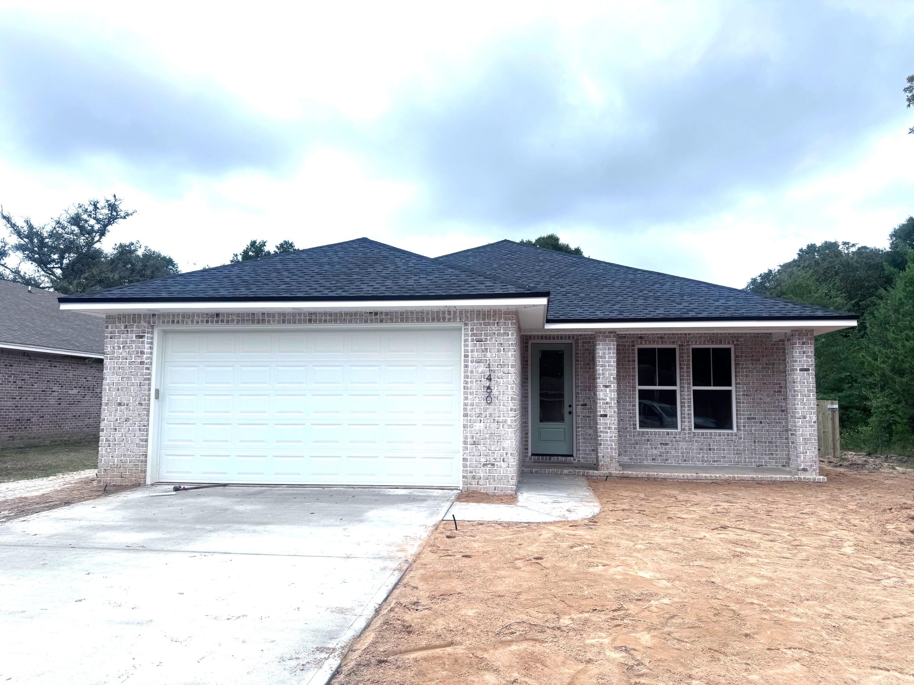 NEW 4 bedroom home. EXTERIOR FEATURES: All brick, privacy-fenced yard, 2 car garage w/ auto opener, irrigation system, well pump & landscaping. INTERIOR FEATURES: Open floorplan, granite kitchen tops, stainless steel kitchen appliances, large pantry, marble bathroom vanity tops/tubs/shower, tile in baths, & utility, laminate wood flooring all other areas including bedrooms, large crown molding in main areas, large baseboards, plenty of storage. OTHER FEATURES: A 1-yr builder warranty is provided, closing to be held with Tammy Jones at First National Land & Title
