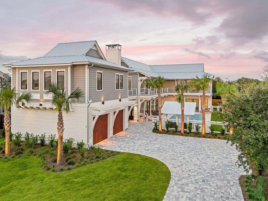Located on 30A between Alys and Watersound and just a block from the beach, this newly completed home is brimming with quality features, from hardwood flooring and coffered ceilings to shiplap walls and textured tiles. Uniquely designed as a two-story residence, this home offers a more accessible, livable layout than others without sacrificing space or luxury. The broad paved driveway provides a grand approach to the main home and carriage house above the two-car garage. Thoughtfully built as an attractive second home or investment property, it caters to those seeking easy one-story living, generous closets, and open entertaining spaces. This well-appointed beach house is perfectly designed around the courtyard, pool, and gas fire pit. The open family room is focused on pool views with expansive windows introducing abundant natural light. The deep coffered ceiling with grained wood inserts and crushed shell fireplace add additional warm touches to the home. Enter the chef's kitchen, which is superbly appointed for entertaining with a farmhouse sink, dual dishwasher, two side-by-side refrigerators, a 48" gas range, and butler's pantry complete with beverage cooler and prep sink. Under-cabinet lighting, wall sconces and textured tiles add additional luxury touches to spaces throughout the home. Two primary suites include one on each floor. The first-floor suite has an enviable walk-in closet/dressing room with built-ins. Doors open directly onto the pool. A sliding barn door hides the magnificent master bathroom with dual vanity. A wet room-style shower has two separate shower heads and an oval soaker tub within the glass-enclosed space. The second-floor master suite is similarly spacious, with another custom walk-in closet and a huge shower with dual heads. Doors open onto the lengthy wraparound balcony, providing a space to quietly read or watch sunsets. An additional six bedrooms including a bunk room offer versatility. Upstairs the generous media room complete with sconce lighting is a great space for a group to watch movies, play games, or just relax together. Stairs from the terrace lead up to the guest house above the garage. It includes a kitchenette, sitting room, two bedrooms and a bathroom, ensuring guests are comfortably accommodated. The quarter-acre landscaped grounds include the 30X15 pool, a sitting area with fire pit and a cantilevered gazebo, providing a shady place to relax. Make this your family's beach retreat or a coastal investment. Either way you'll love calling this extraordinary 30A property home.