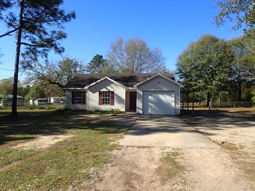This REO home is located on the north end of Crestview, but is still just minutes away from businesses, churches, schools and more. Built in 1999 and resting on right at 1 acre, this 3 bedroom 2 bath home has fenced back yard, vinyl siding and 1 car garage. Home needs some TLC and therefore will only qualify for rehab loans at this time. A definite must see if looking for that next diamond in the rough! Call today!