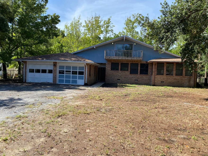 Great investment opportunity on this unique property with basement and built in safe on a large lot. Close to school, shopping and Navarre Beach. Buyer to verify all pertinent data including square footage. Property to be sold AS IS.