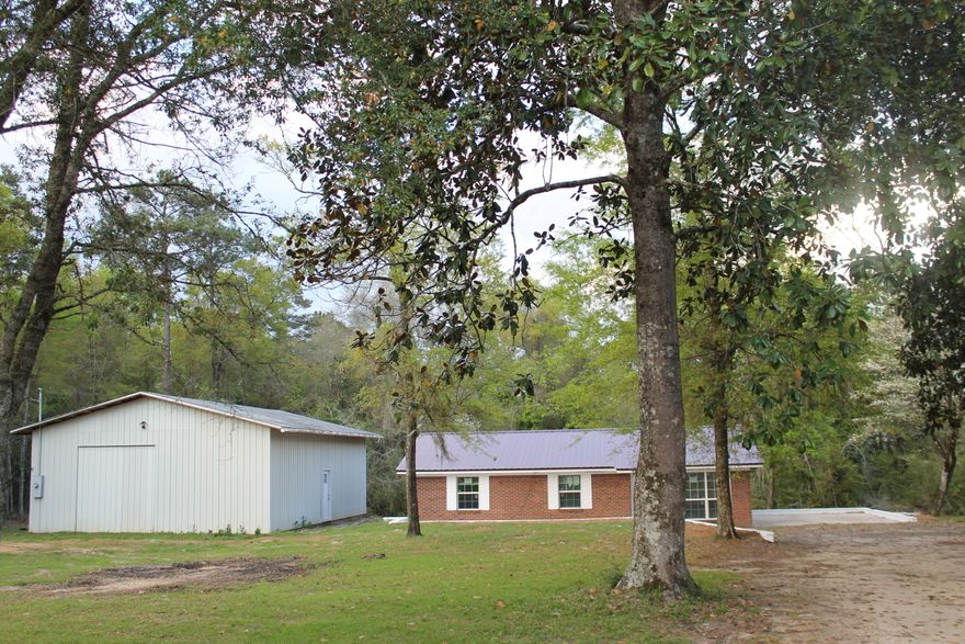 Completely Renovated 3 Bedroom all brick home with a New Metal Roof, New Doors, New Carpet, New fixtures, 140 mph Windows, New Stainless Steel Dishwasher and Oven/Stove, New Kitchen Cabinets, Stainless Steel Deep Sink, Stainless Steel Vent Hood, New Heat Pump, New A/C, New Water Heater! 30 X40 Shop that can also be used as a Detached Garage! Auburn water is in place but the well is drilled for future irrigation or living off grid! Come see this newly remodeled home today on nearly an Acre of land!! The Dogwoods are in bloom ! Ready for your shop project and the family!