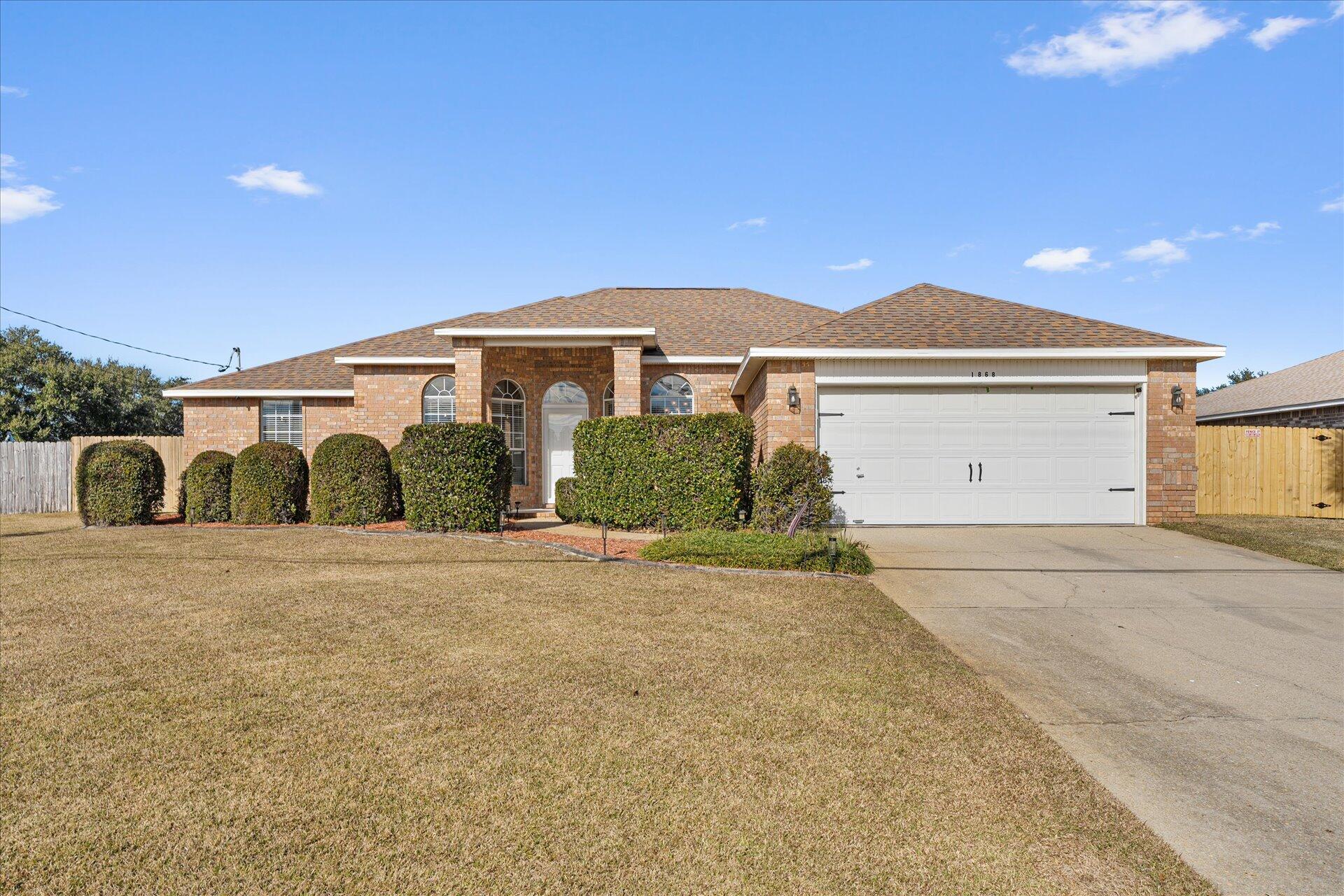 Come check out your new beautifully updated and well-maintained pool home with NO HOA in the Holley/Navarre area.  This bright and open floor plan boasts 4 bedrooms and 2 bathrooms.  Updated kitchen with stainless steel appliances, granite countertops, travertine backsplash and kitchen island.  The windows have been re-paned. Tile and LVP in wet areas, and carpet throughout rest of home.  Recently painted. Large master bedroom that leads into master bath with double vanity, granite countertops, walk-in shower and separate garden tub and also 2 walk-in closets.  Walk out the back doors to an outside oasis with your in-ground pool and enclosure and your outdoor dining space. New privacy fence, newly sodded back yard, new pool pump, newer pool liner and roof is 4 years old.