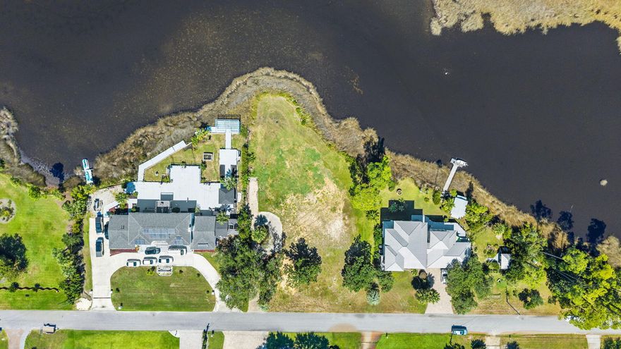 Build your own dream retirement or second home on this beautiful waterfront lot. Sunset views make this lot a preferred choice for a homesite. It offers stunning views stretching across the bayou to North Bay. Located in a well established neighborhood with close proximity to hospitals, schools, grocery stores, coffee shops and fast food. 135' of waterfront and .60 of an acre. Recent survey is available for review.