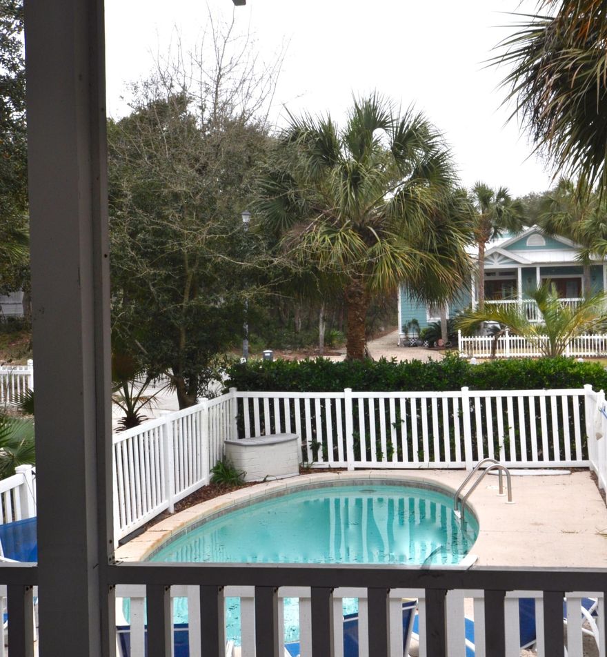 Priced to sell! This charming cottage is situated lakefront with Gulf views.This home has been professionally decorated and is a beautiful property as a second home, rental property or a primary residence. 4BR, 3BA cottage with private pool located in a cul-de-sac. Cottage has screened porches on each floor with a large sun deck on the top floor outside of the third floor bonus room with wet bar. There are solid maple wood floors, granite countertop in the kitchen with a separate vegetable sink, stainless steel appliances, track lighting, designer fans, French doors, recessed lighting, security system, surround sound, vinyl windows which tilt in for easy cleaning, 2 AC units, and all within walking distance to the beach.