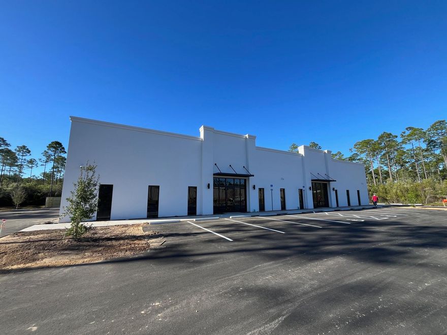 Brand new ~ 5,000 SF warehouse space available in Beach Commerce Park in Panama City Beach, FL.  This building is shared with B & C Fire Safety (right side).  The available space is located on the left side of the building.  Nice storefront entry feature with several windows along the front of the space.  The space is currently a large open warehouse space with plumbing stubbed up.  A single 12' roll up door accessed on the south-side of the building along with a pedestrian door.  This 1st generation space has so many possibilities.  This open floor plan can be modified to suit your needs.  We have plenty of parking on property and truck loading area.  225 amp power in place with capacity to add  3 phase power. Come check out this new space for your thriving business.  Rate structure he
