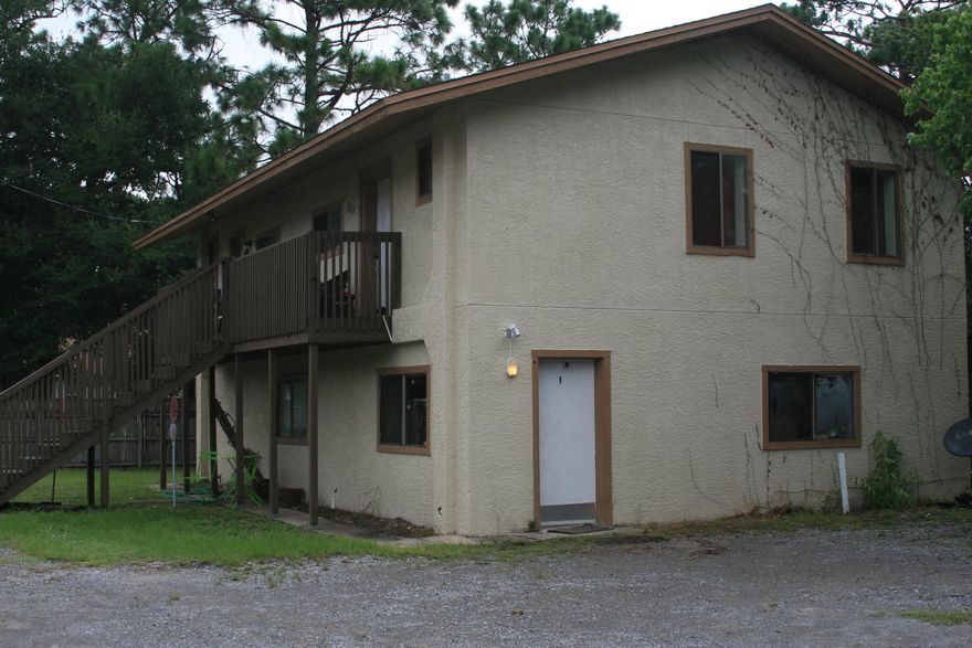 This is a rare opportunity to own a tri-plex in Shalimar, at a great price! This building has a 3 bedroom 1 bath unit on the ground floor that comprises 1,080 square feet and 2 separate units upstairs that are 1 bed 1 bath each, comprising 500 square feet each. Parking is uncovered but there is ample room to easily fit many vehicles. This would be an ideal situation for an investor, or for someone wanting to live in one of the units while renting the other two. These kinds of offers don't come around very often so CALL the listing agent, Mike Marston, ASAP!