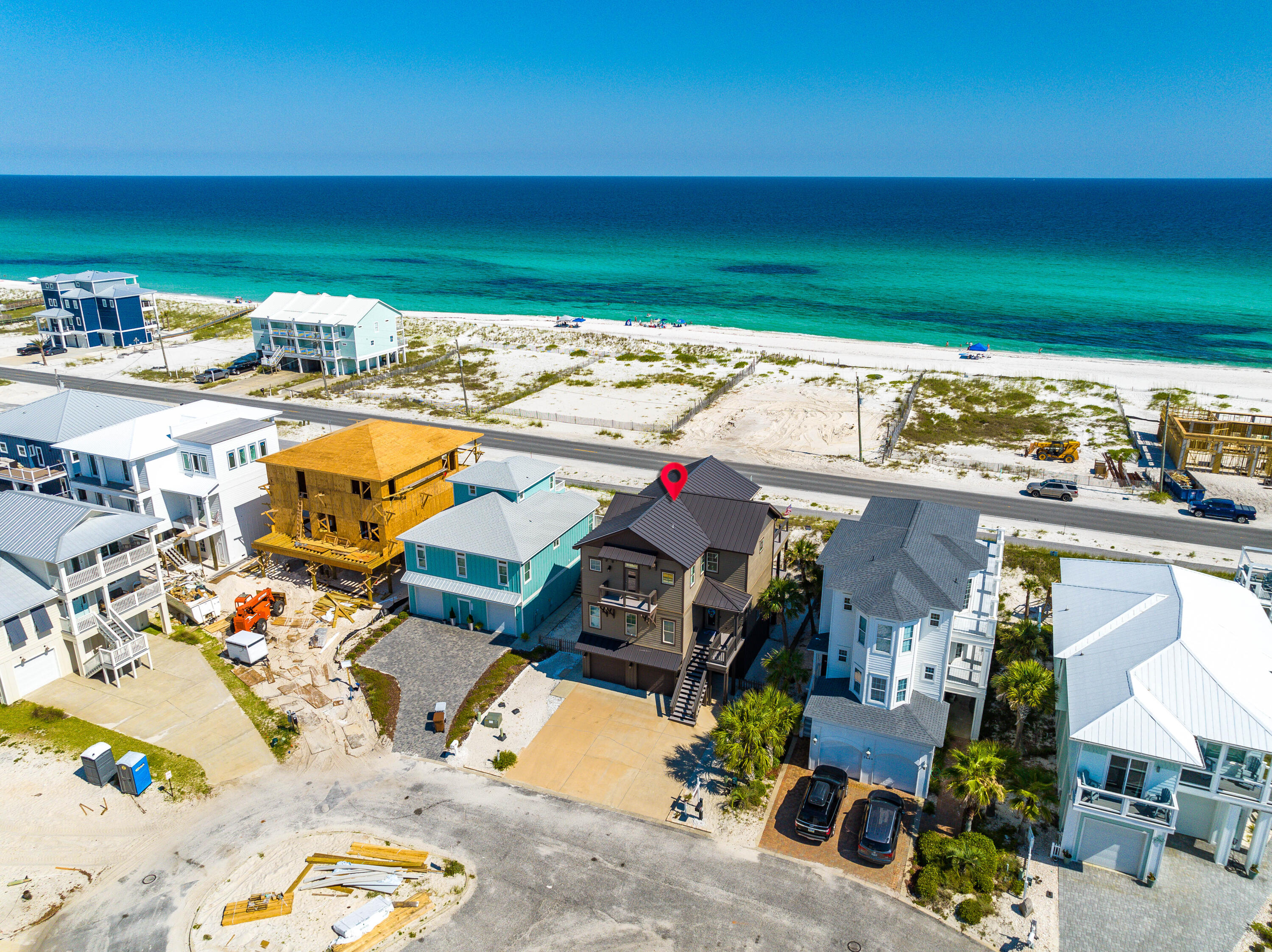 Panoramic view of the Gulf of Mexico. Built to the newest standards, this 2017 built home with upgrades galore is a must-see. Fully furnished with a Golf Cart, one owner and never rented, this pristine home offers 10 foot ceilings throughout, quartz countertops, impact glass windows and doors throughout, 4 bedrooms, 4 and a half baths, an elevator, and over 800 square feet of outdoor decks, on a premium lot in the furthest West end community on Navarre Beach! With multiple angles and stunning views of the Gulf, Santa Rosa Sound, and Gulf Islands National Seashore, this home presents indoor/outdoor surround sound, plus stunning beach views from the Primary Bedroom, Kitchen/Living area. Located between the Santa Rosa Sound and the Gulf, this piece of paradise offers access to both waterways.