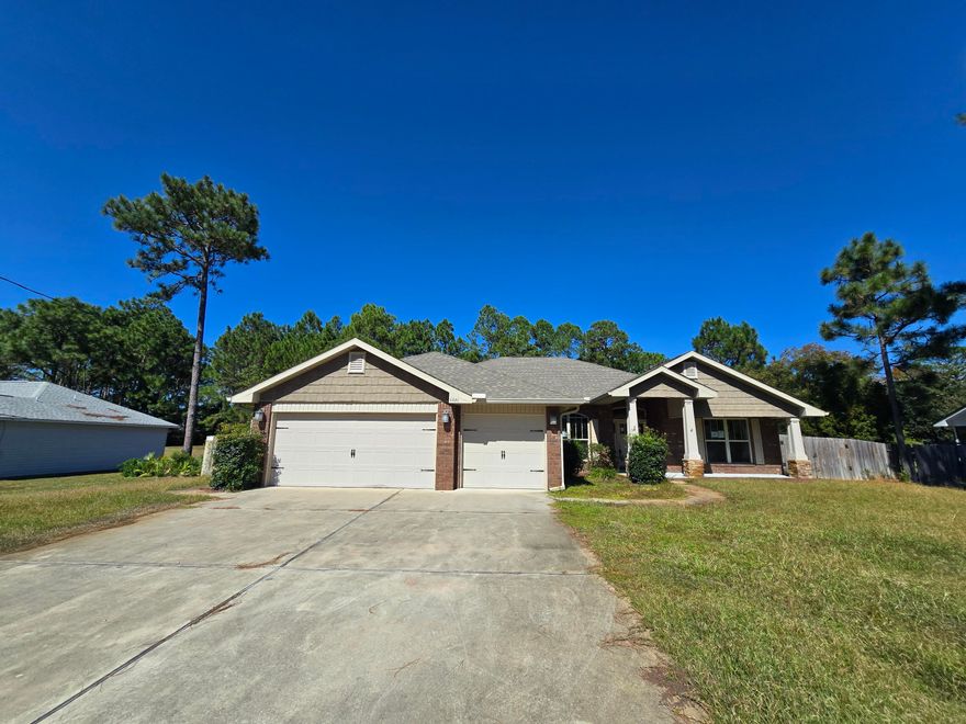Welcome to Holley By The Sea! 4 bedroom, 3 bathroom home featuring an open and split floor plan, office/study and 3 car garage. A welcoming front porch greets you. Stepping inside you will find an expansive open living area with high ceilings, plant ledges and a wood burning fireplace surrounded by a beautiful slate wall. The designer kitchen boasts granite countertops, stainless steel appliances, microwave, breakfast bar, and a spacious breakfast nook. The dining room is open to the living area, ideal for entertaining. The primary bedroom suite features a trey ceiling, 2 closets, tiled shower, garden tub, private toilet room, and double vanities. The backyard features a covered patio and and an open patio with custom pavers. The outdoor area is set up for entertainment. Enjoy the ameniti ties this homeowners association offers including 2 community pools, a wading pool, execise room, tennis courts, pier, playground and much more!