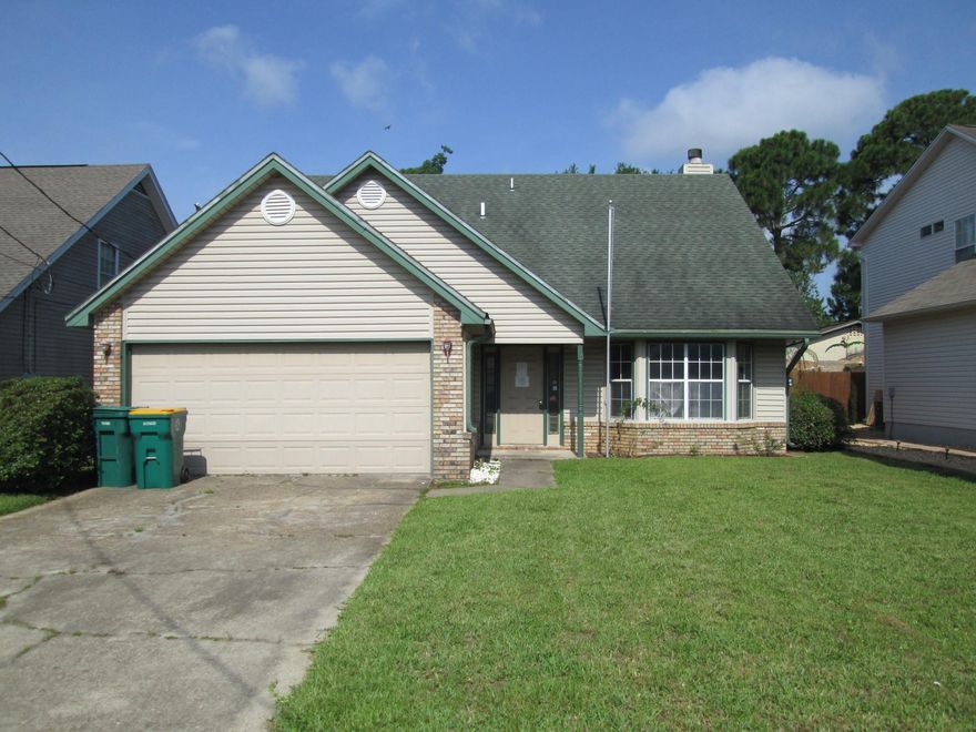 REO. Great home in need of a little TLC! Outside the home, you have some brick siding paired with vinyl siding. Inside the home you are greeted with stairs leading up to a loft area and a bedroom. Back on the first floor, you have a living room complete with a fireplace. The kitchen features beautiful cherry cabinets, pantry, and a convenient eat-in area. The master bedroom is conveniently on the first floor as well. This home is located west of Hurlburt Field and is a short drive away from Florosa Elementary School. Being sold AS IS.