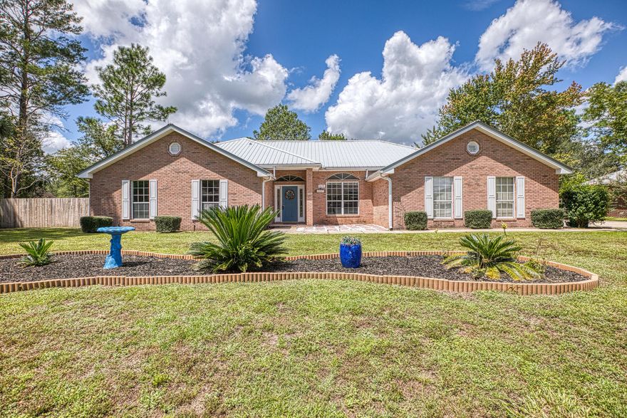 Looking for a beautiful move-in ready home in Crestview? Look no further! This all brick 2676 sq ft home with metal roof, new HVAC and of an open floor plan conveniently located minutes from Duke Field, 7th SFG, and only 30 minutes to Hurlburt and Eglin. Upon entering the home you will find an open floor plan with vinyl flooring throughout,  spacious living and dining area, gorgeous gas fireplace, and newer lighting fixtures. The eat-in kitchen has room for a 6 person table. The kitchen is white with granite counters, double oven, newer cabinet knobs and conviently around the corner is the half bath and laundry room. The Florida room is just off the kitchen where you can relax and enjoy a cup of coffee or this space can be used for a play area, workout space or reading room. You will love the 3 large additional bedrooms which share a hall bath with dual vanity, tub and shower surround.

The master bedroom is oversized, allowing ample room for large furniture, trey ceiling and walk-in closet. The master bathroom comes equipped with a garden tub and separate shower, perfect after a long day.  

Finally, the home has a lovely fenced in private backyard, concrete patio to enjoy your afternoons outside, workshop with power, large driveway allowing for additional parking.