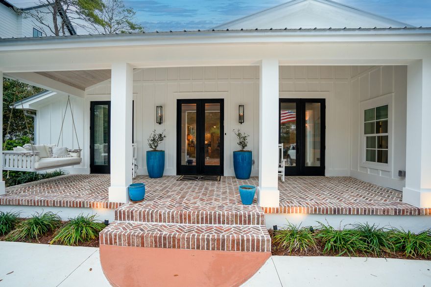 Welcome to 102 Camp Creek Road S, where modern luxury meets coastal charm in the heart of Inlet Beach, FL. This single-story renovated masterpiece spans 3,809 square feet, offering a harmonious blend of timeless design and high-end comforts, all just steps from the beautiful emerald beaches of 30A.From the moment you step inside, you'll be captivated by the rich character of 120-year-old reclaimed wood floors that flow seamlessly throughout, extending to the inviting screened porch. The home features 5 generously sized bedrooms, including 2 lavish primary suites, and 4.5 impeccably designed bathrooms, ensuring space and privacy for everyone.  Designed with entertaining in mind, the open-concept living areas are nothing short of spectacular.  The gourmet kitchen is a chef's dream, boasting 2 dishwashers, 2 refrigerators, a wine bar, and an extended pantry. Gather around one of the 3 fireplaces--1 woodburning, 1 gas, 1 electric--or retreat to the oversized media/rec room for a cozy movie night.

Step outside, and the allure continues. The heated pool and spa invite you to unwind, while the outdoor kitchen and retractable screened porch make hosting al fresco dinners effortless. Just across the street, you'll find private dock access to picturesque Camp Creek Lake, perfect for kayaking, paddleboarding, or simply soaking in serene lake views. Thoughtful touches like the circular driveway, outdoor shower, and large laundry/mudroom with its own exterior door add convenience to your everyday coastal lifestyle.

Nestled within walking distance to the pristine beaches of 30A, this home is more than just a house--it's a sanctuary designed for relaxation, connection, and unforgettable memories. Don't miss your chance to own this extraordinary retreat and experience the best of coastal living.

Professional photos coming soon!