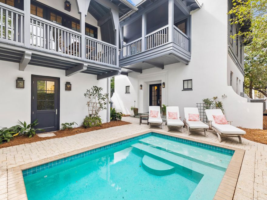 Step inside a realm of elegance at this luxury enclave that comprises a beach cottage and a carriage house that can be rented separately. Renovated by Tracery Interiors, this exclusive Rosemary Beach residence is tailor-made for those looking for luxury, convenience and tranquility. Arranged around a peaceful courtyard with heated pool, the newly painted main house has two updated master suites and a bunk room on the first floor with beautifully curated living space above. The great room is bright and open with rich hardwood flooring and a plethora of windows introducing an abundance of daylight. It seamlessly segues into the magnificent chef's kitchen which is fully equipped with Signature appliances including the fridge, stove, microwave and dishwasher. Custom cabinetry and waterfall