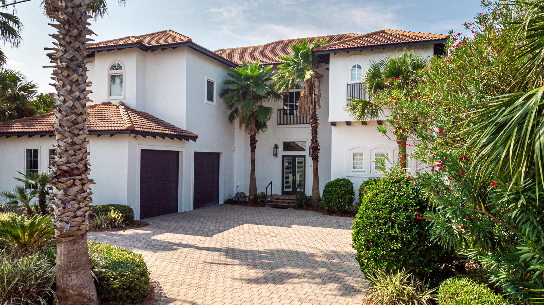 Come enjoy life on Destin's sought-after Holiday Isle. This gorgeous home overlooking a deep-water canal has everything!  Boater enthusiast will love the convenience of two boat slips. One equipped with a 15Klb lift and the second with 24Klb lift plus a dock configuration featuring a 100 AMP service for larger vessels. The new owners will enjoy the luxury of relaxing by the heated pool with a stone patio deck, and gas firepit, all within a short walk to a private deeded access to the white sandy beaches of the Gulf of Mexico. The exterior is concrete construction and designed for low maintenance cost. The interior of this home, designed for luxury living, will please the pickiest buyer. Call today for a private showing. You will not be disappointed!