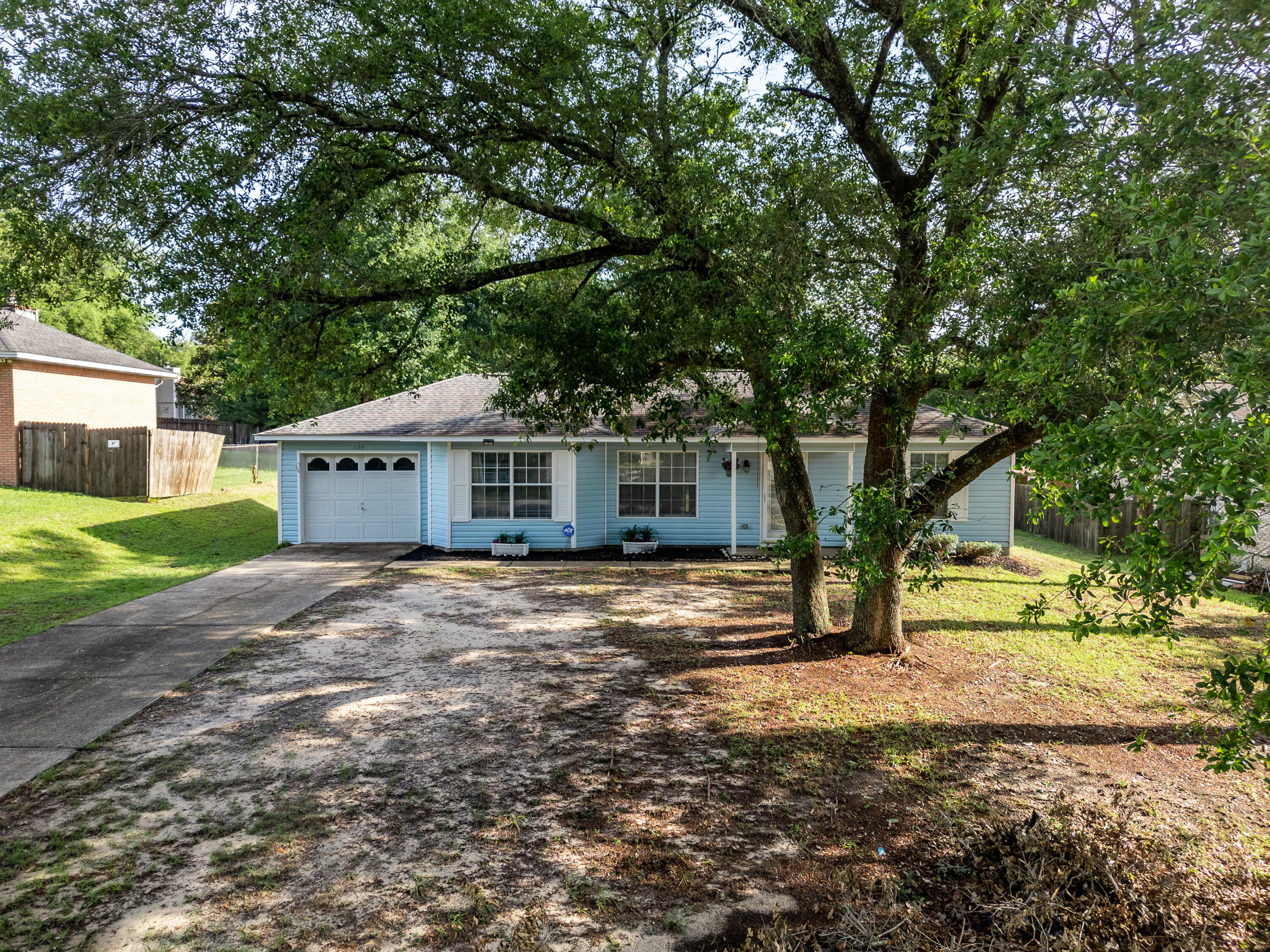 Charming and efficient, this Crestview gem offers the perfect blend of comfort and space! Nestled on a generous .32-acre lot, this home features an open floorplan that maximizes every square foot, making it feel light, bright, and welcoming. The split-bedroom layout provides added privacy, making it ideal for families, guests, or a home office setup. Notable updates include a roof in 2014 and a new water heater installed in 2021. Enjoy the peace of a spacious yard with plenty of room for gardening, entertaining, or future expansion. Whether you're a first-time buyer, downsizing, or investing, this property is full of potential!