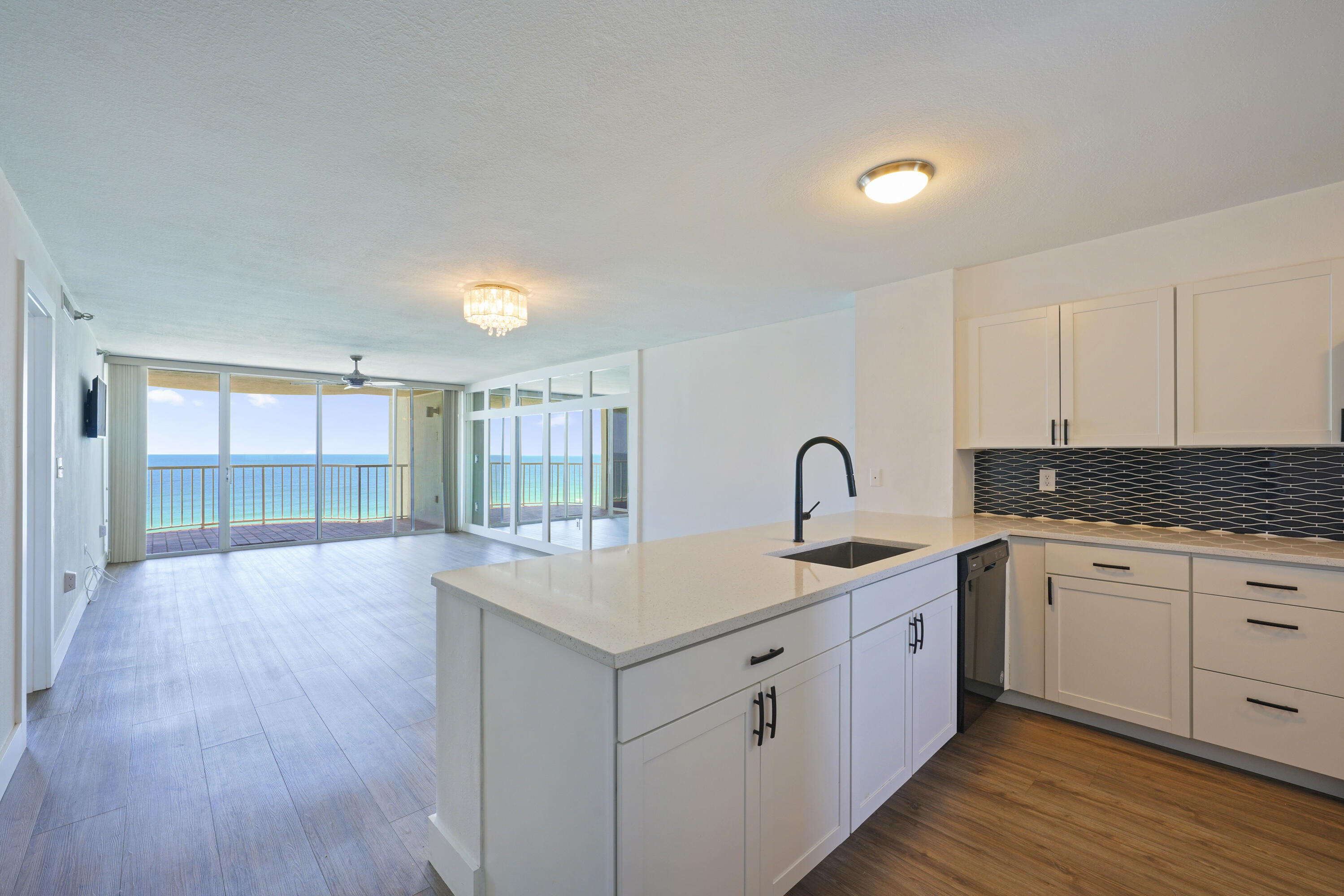 SPECTACULAR VIEWS ***10TH FLOOR GULF FRONT *** PRIVATE BEACH*** GATED COMMUNITY WITH 24-HOUR SECURITY*** EASY TO SHOW ANYTIME!WELCOME TO YOUR DREAM BEACHFRONT CONDO AT 9815 US HIGHWAY 98 W UNIT 1004 IN HIDDEN DUNES! THIS EXQUISITE 10TH-FLOOR GULF FRONT UNIT OFFERS BREATHTAKING VIEWS AND A LIFESTYLE OF LUXURY AND TRANQUILITY. RECENTLY RENOVATED THROUGHOUT, THIS CONDO IS A COASTAL HAVEN, BOASTING A SOOTHING AMBIANCE WITH COASTAL HUES AND GORGEOUS NEW LVP COASTAL WOOD-LIKE FLOORS. STEP INTO THE FULLY RENOVATED KITCHEN, COMPLETE WITH GLEAMING NEW QUARTZ COUNTERTOPS, DEEP SINK, WHITE SHAKER CABINETS, AND TOP-OF-THE-LINE APPLIANCES, INCLUDING A MICROWAVE, STOVE, DISHWASHER, REFRIGERATOR, WASHER, AND DRYER. ENJOY THE STUNNING GULF
