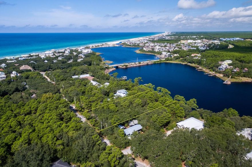 Large Camp Creek Lake lot! At just under .5 of an acre, this lot has 70 feet of lake frontage and is approximately 280 feet deep. In addition, the lot's southern edge boarders a 60 foot neighborhood easement, which gives the lot an even larger feel. With a current elevation of approximately 20-25 feet at the lot's buildable center, this lot will provide exceptional views to the future home owner. Lot will convey with a set of custom home plans from A Boheme Design. These plans call for an impressive 3,412 square foot residence; with three bedrooms, a bunk room, giant open living space, a foyer, a study, an upstairs den, a large mud room & laundry room, awesome outdoor living space, indoor and outdoor fireplaces, and a two car oversized garage.