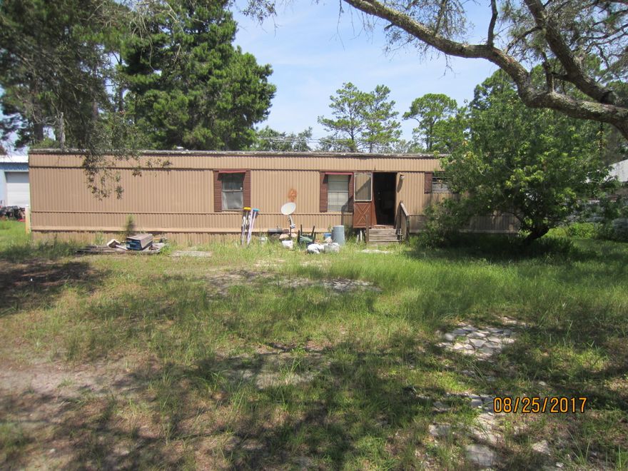 Older mobile home in very poor condition. 2BR/1BA. 784 sq ft. Beautiful lot in a nice area with storage shed and nice trees. Property is vacant and has not been lived in for a long time. Needs repairs to floors. Excellent location near Sandestin Area.Property is being sold ''AS-IS'' No repairs will be done.
