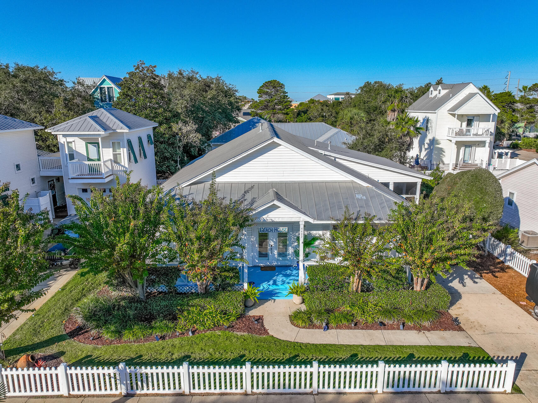 Fabulous Beach Cottage! As you enter, you are greeted by wood plank floors which grace the living area, while soft carpeting provides comfort in the bedrooms. The open-concept layout seamlessly connects the living room, dining room and kitchen, creating a welcoming flow for gatherings. The kitchen boasts granite countertops, white cabinetry, stainless steel appliances, a farmhouse sink and a spacious pantry. The master suite includes a luxurious bath and walk-in closet, while the second and third bedrooms share a stylish hall bath. Accessible from both the kitchen and master bedroom, one of the property's many standout features is the inviting side porch, perfect for relaxing with morning coffee or evening relaxation. Both the front and side porches offer cozy spots to unwind and enjoy the coastal breeze. 

Additional features include a gas-log fireplace, ten-foot ceilings, an oversized storage room off the screened porch, a fenced backyard, irrigation system, lush landscaping, groundskeeping and a security system. Best of all, this gem is just one and a half blocks from the beach.

Ideally situated on the idyllic single-outlet street of Clipper Cove, the property enjoys low traffic and the added bonus of a fenced community pool directly across the street for the enjoyment of owners and guests. This beach cottage truly offers a slice of coastal paradise!


