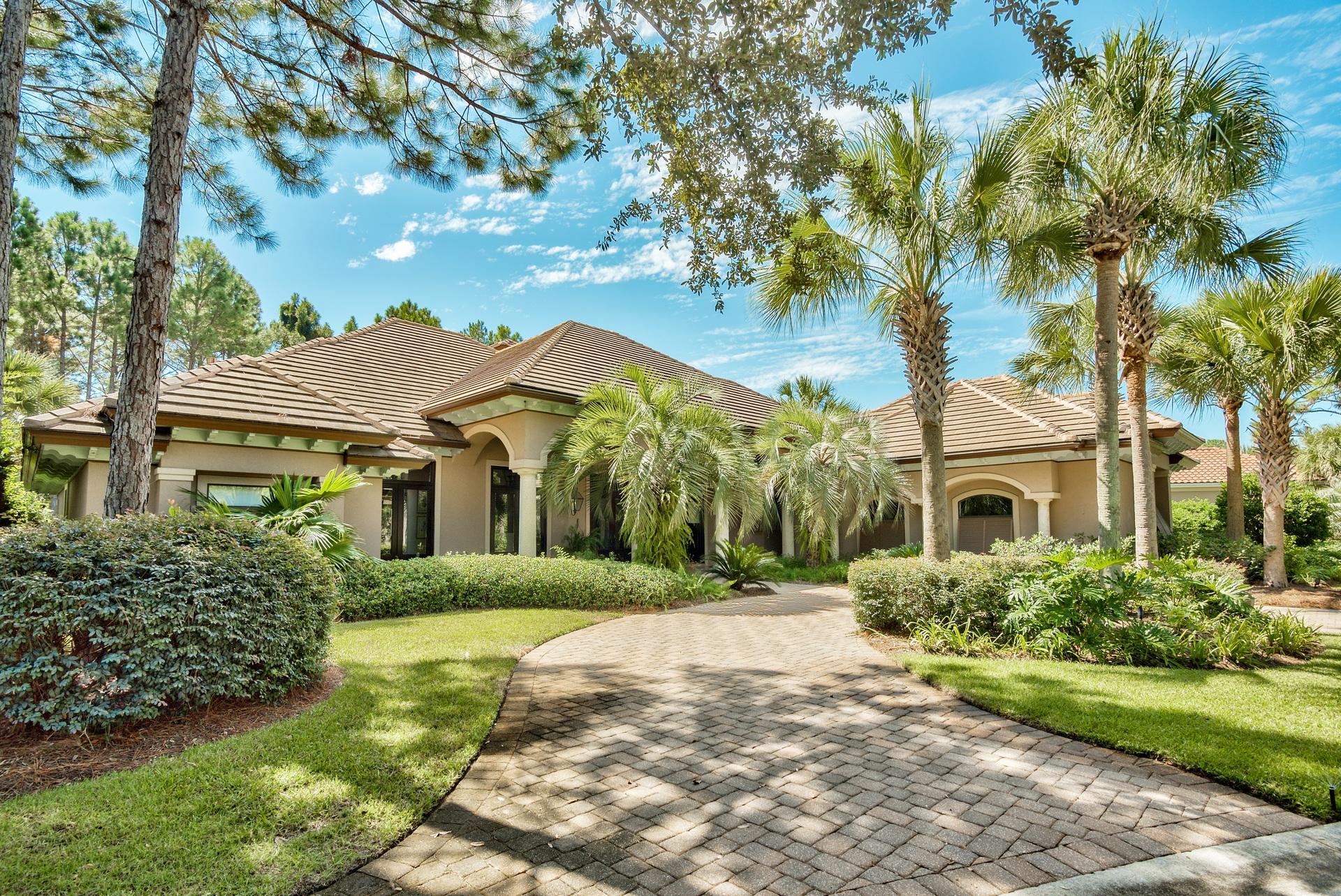 NEW NEW PRICE...CARIBBEAN STYLE ONE STORY HOME SITS BEHIND THE GATES AT THE MOST PRESTIGIOUS NEIGHBORHOOD ON THE RESORT. THE CUSTOM HOME HAS 3 BEDROOMS 3 BATHS PLUS A STUDY. HOUSE SITS ON THE 14TH HOLE OF THE RAVEN GOLF COURSE WITH LOTS OF PRIVACY.THE LARGE FRONT PORCH HAS AN AUTHENTIC PALE BLUE CEILING, BAHAMA SHUTTERS, GAS LANTERNS, AND BEAUTIFUL MAHOGANY FRENCH DOORS. THE INTERIOR HAS COLONIAL WEST INDIES INFLUENCE WITH DARK, DISTRESSED HARDWOOD FLOORS AND 3 FIREPLACES. MOST OF THE HOME HAS 12 FT CEILINGS AND 8 FT DOORS. THERE IS A COMPLETE OUTDOOR KITCHEN AND LIVING AREA WITH A STACKED STONE WOOD BURNING FIREPLACE WITH A TV CABINET OVER THE CEDAR MANTLE PLUS AN ENCLOSED POOL. GOURMET KITCHEN WITH ALL HIGH END APPLIANCES AND A WINE BAR.