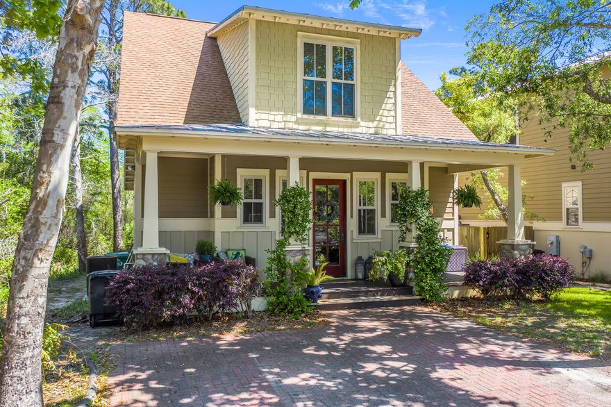 Dont miss this opportunity to call Grayton Cove home! The property is perfect for the full time resident or as a vacation house. Lots of windows, plantation shutters, main level hardwood floors, and a stone fireplace in the living room. The bathrooms have slate showers and flooring and granite countertops. The master bedroom is located on the main floor and features a separate bath and shower, along with double sinks. There is a walk-in closet located off of the master bathroom. There are 2 additional bedrooms upstairs that share the second upper level full bathroom. Large closets in both bedrooms allow tons of storage! In addition there is a  porch located off of the kitchen. The high ceilings make this comfortable and open floor plan feel and live large.