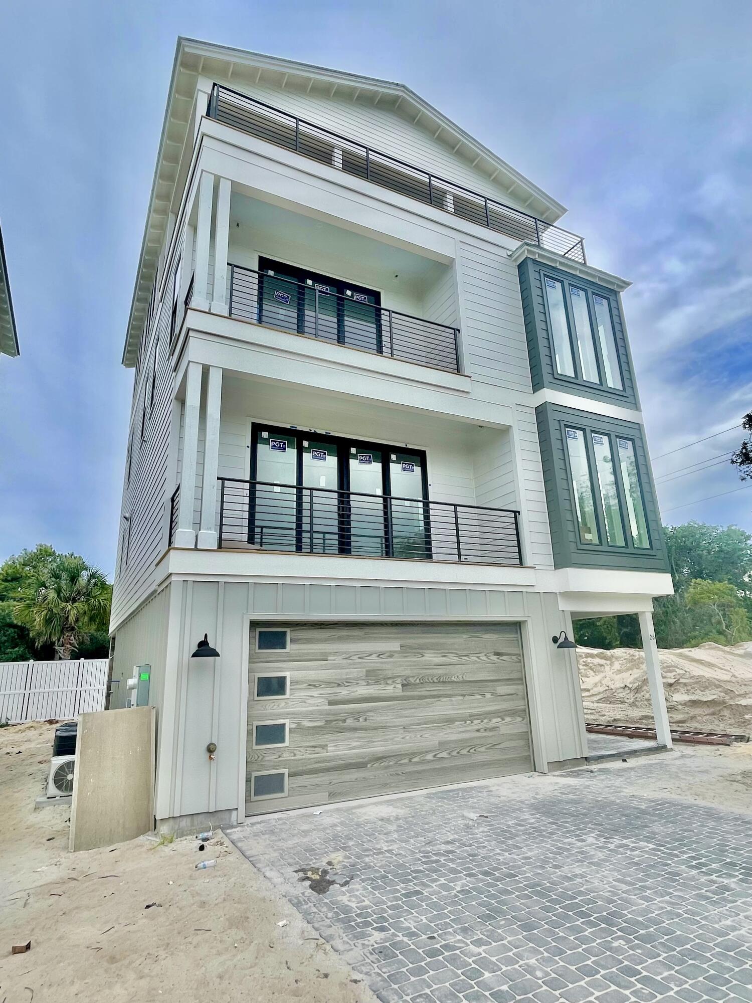 Gorgeous four-story rental dream under construction, south of 30A on Mary Street in Blue Mountain Beach. (Rental income projections are $215,000+/-) Take advantage of preconstruction pricing and add your personal touch to finishes. (June 2025 completion date) Perfect for indoor/outdoor entertaining, the first level includes a half bath and mini kitchen with a full sliding wall that opens to the pool deck. The second floor features the spacious kitchen, dining and living area, perfect for large families or parties to gather. The kitchen features Thermador appliances, a gas stove, ample counter space for serving, and a walk-in pantry. The third floor boasts a lovely master suite with a private balcony. The master suite as well as 2 guest suites with private bathrooms are also available on the third floor, one of which would be ideal for a multi-bunk room. On the 4th floor the home features 2 additional bedrooms with private ensuite bathrooms. Also on the 4th floor is a huge covered deck area with amazing gulf views. The home also features an elevator as well servicing all 4 floors.
The pool deck will also have shaded areas to enjoy as well ample sunbathing space. The beach is just a short walk (less than 5 minutes). The two car garage will be ideal for parking in addition to storing anything you need from beach items to a golf cart.
Blue Mountain Beach is one of the best beach communities on 30A with less crowds on the beach, easy access to restaurants and entertainment.