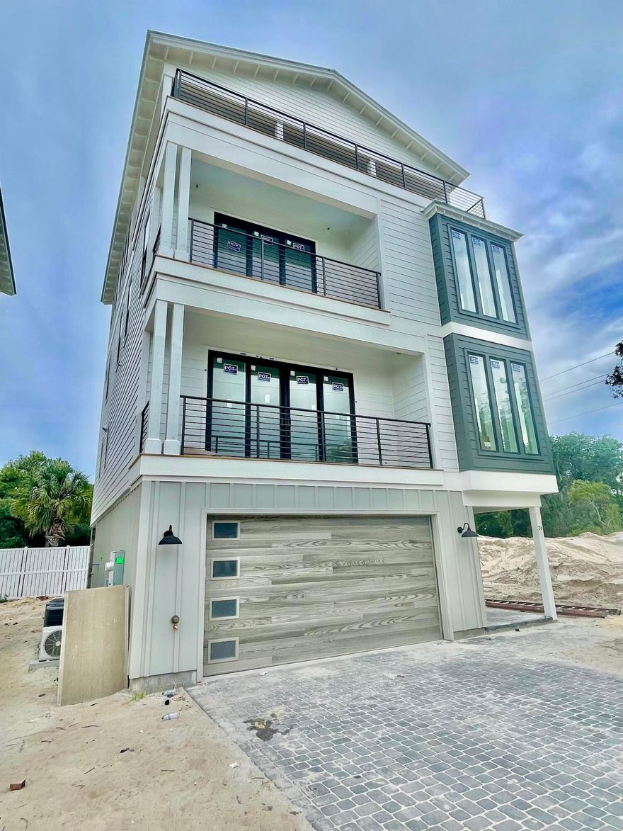 Gorgeous four-story rental dream under construction, south of 30A on Mary Street in Blue Mountain Beach. (Rental income projections are $215,000+/-) Take advantage of preconstruction pricing and add your personal touch to finishes. (June 2025 completion date) Perfect for indoor/outdoor entertaining, the first level includes a half bath and mini kitchen with a full sliding wall that opens to the pool deck. The second floor features the spacious kitchen, dining and living area, perfect for large families or parties to gather. The kitchen features Thermador appliances, a gas stove, ample counter space for serving, and a walk-in pantry. The third floor boasts a lovely master suite with a private balcony. The master suite as well as 2 guest suites with private bathrooms are also available on the third floor, one of which would be ideal for a multi-bunk room. On the 4th floor the home features 2 additional bedrooms with private ensuite bathrooms. Also on the 4th floor is a huge covered deck area with amazing gulf views. The home also features an elevator as well servicing all 4 floors. 

The pool deck will also have shaded areas to enjoy as well ample sunbathing space. The beach is just a short walk (less than 5 minutes). The two car garage will be ideal for parking in addition to storing anything you need from beach items to a golf cart.

Blue Mountain Beach is one of the best beach communities on 30A with less crowds on the beach, easy access to restaurants and entertainment.