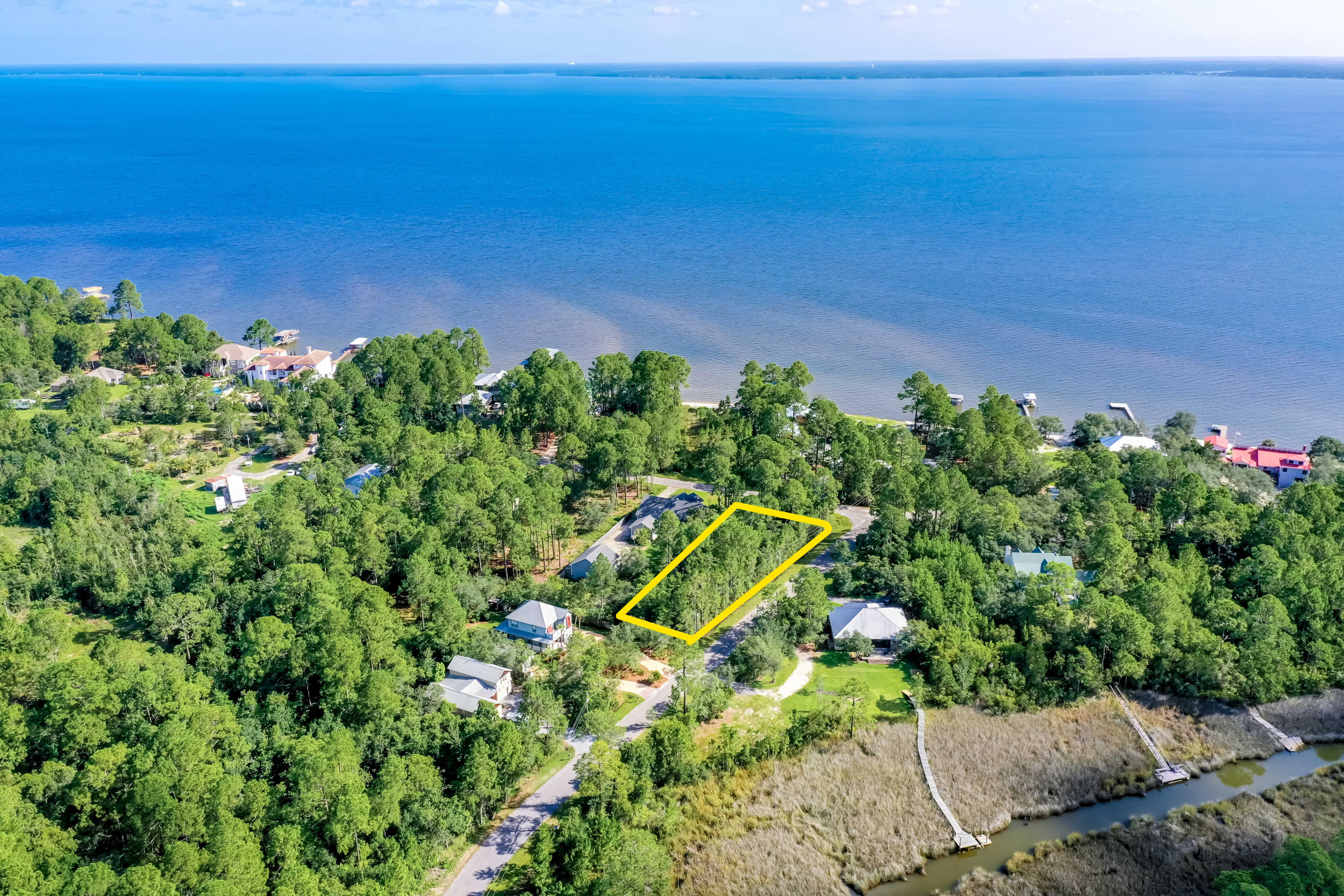 Attractive and affordable homesite across the street from Choctawhatchee Bay! This property is located in north Santa Rosa Beach and only a short drive and/or nice bike ride to the area's finest beach-front access via Ed Wallene Park at Gulf Place, as well as being a short jaunt from Hogtown Bayou's premier bayfront park, which features boat ramps and a newly redeveloped county play park with picnic facilities in the historic Town of Santa Beach.Buyer must verify all data and specifications.