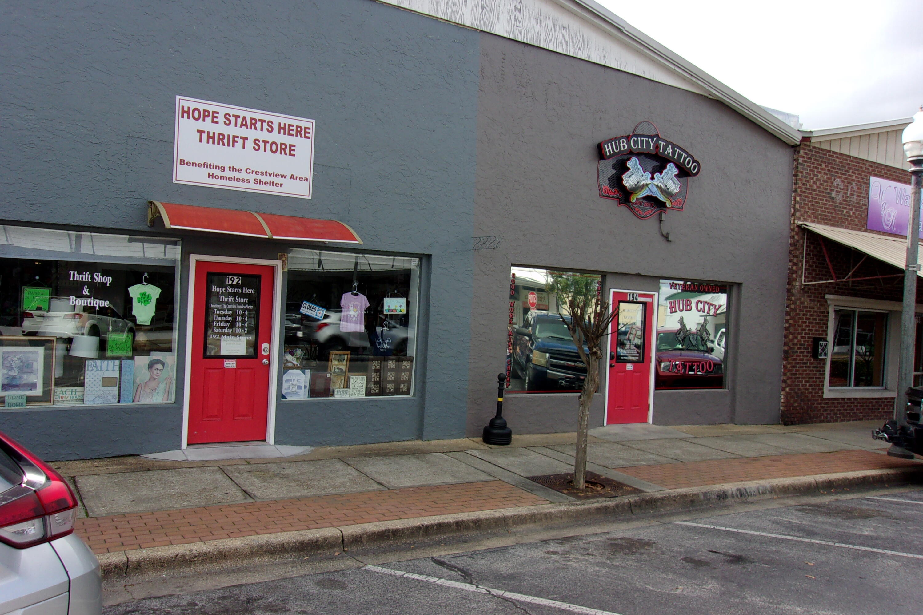 Two (2) Main St units in one building - current tenants are a Tattoo Shop and a Second Hand Store - this would be a great investment property or own your own building / business. You decide!! The Tattoo Shop has partitions made of removable walls allowing for a remodel to suit your preference. The other side is an open room with front / reception area - make them what you want them to be or have the existing tenants remain.
