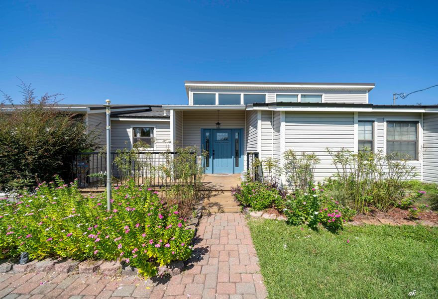 Welcome to your dream home on the outskirts of Panama City! Just 21/2 miles from 23rd Street dining and shopping, this beautifully maintained 3BR/2BA, 2,322 sq ft home features a durable metal roof, solar panels, and no HOA. Inside, the sunken living room boasts soaring 23-ft vaulted ceilings, natural light, and built-in bookshelves. The remodeled kitchen offers quartz countertops, stainless appliances, induction cooktop, mobile island, and walk-in pantry. The master suite includes vaulted ceilings, dual walk-in closets, and a large bath with double sinks, walk-around shower, soaking tub, and patio access. Two additional bedrooms share a farmhouse-style bath with a clawfoot tub. Outdoor living shines with a 683 sq ft deck, 16x16 screened porch, 20x25 bar/workshop, and smokehouse. his home is move-in ready and waiting for its new owners.