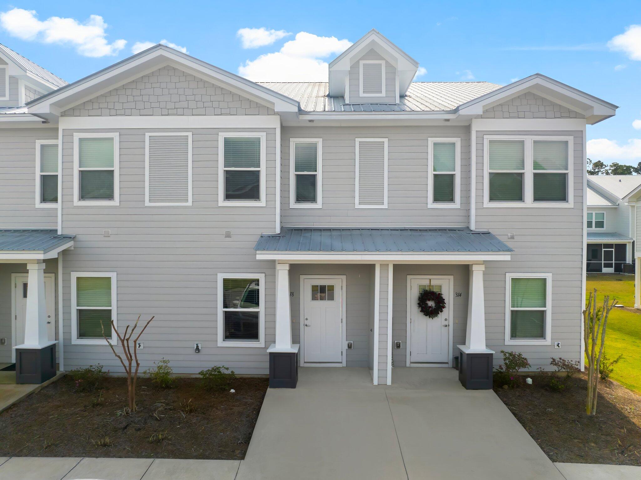 This beautiful 3 bed/2.5 bath townhome has a covered back porch area, quartz counter tops, LVP flooring throughout, all stainless appliances, mini blind window coverings, with a large backyard play area.The Verandas offer wonderful amenities for the entire family! Community pool, pickleball courts, basketball courts and playground.Finishings, interior colors and upgrades may vary.