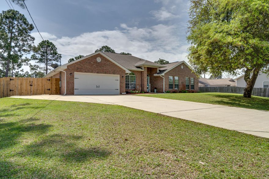 Immaculate home located the desirable Holley by the Sea. Almost 3000 sqft! Great floor plan designed with an Open Concept and Functionality in mind. Featuring a foyer entry with two living room/family rm spaces. Huge kitchen w/center island. Counter tops for miles! Breakfast bar. Large pantry. The spacious master bedroom offers a tray ceiling & very plush newer carpet. The master suite bath boasts a garden tub, separate tile shower and 2 walk-in closets. The 3 other bedrooms are very generous sizes! Enjoy your huge screened in Florida room that overlooks the large fully fenced backyard. Sprinkler system. Plenty of room for you to install a pool. Shed/workshop in the backyard. Additional concrete parking behind the fence for a boat or RV. This home is sparkling clean and move in ready!