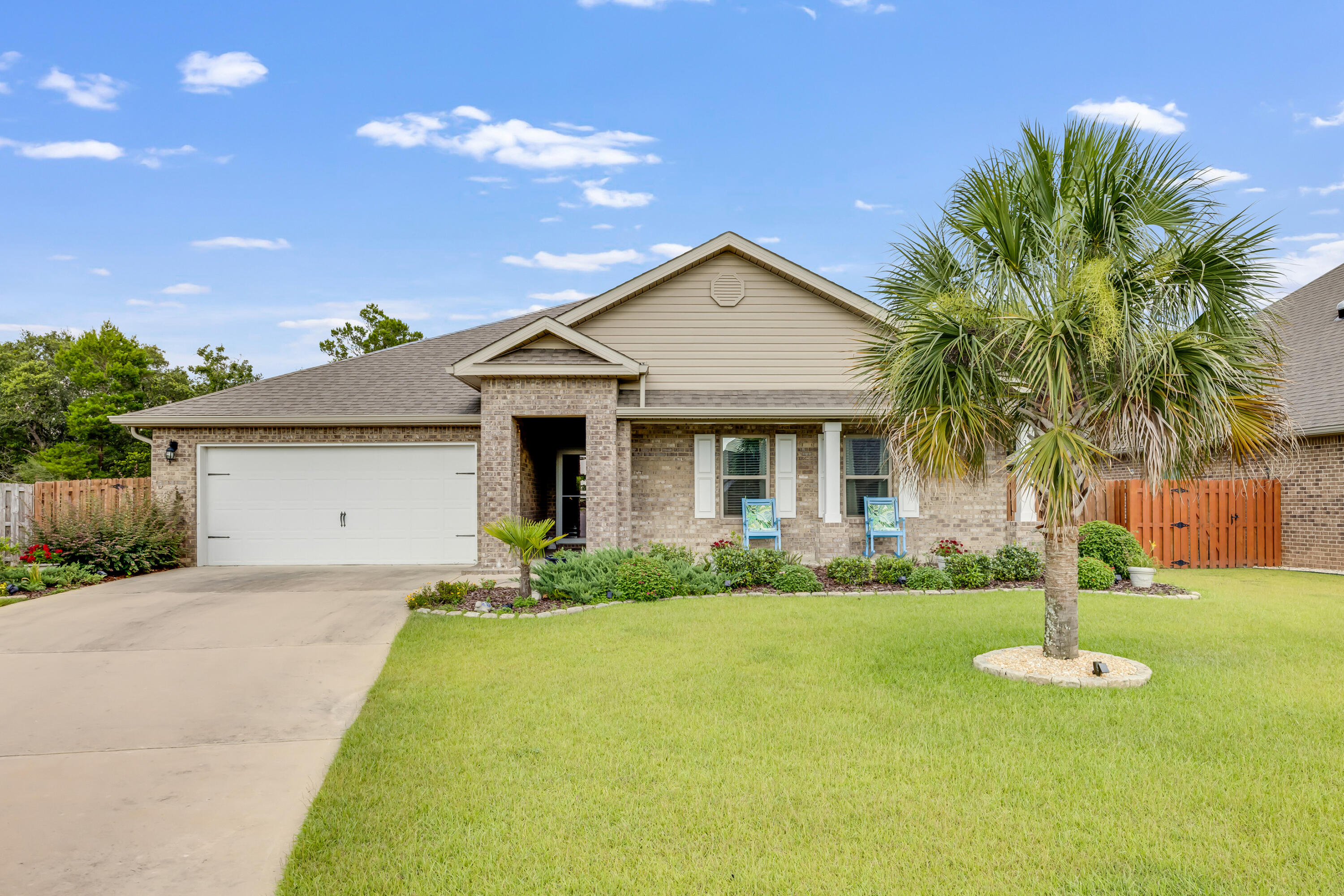 Beautiful 4BR/2BA, 2,347 sqft home in a sought-after neighborhood just north of I-10 with a community pool. The spacious kitchen features a large island, stainless steel appliances, and a refrigerator with icemaker. LVP flooring runs through the main living areas, and the home offers 8 closets for ample storage. Enjoy the screened-in porch with fan, lush landscaping with stone-edged flower beds, a front palm tree, and wooded views in the back. Includes large-capacity washer & dryer, irrigation system, underground drainage, and a garage with sleek Ninja floor coating. Quick walk to local schools.