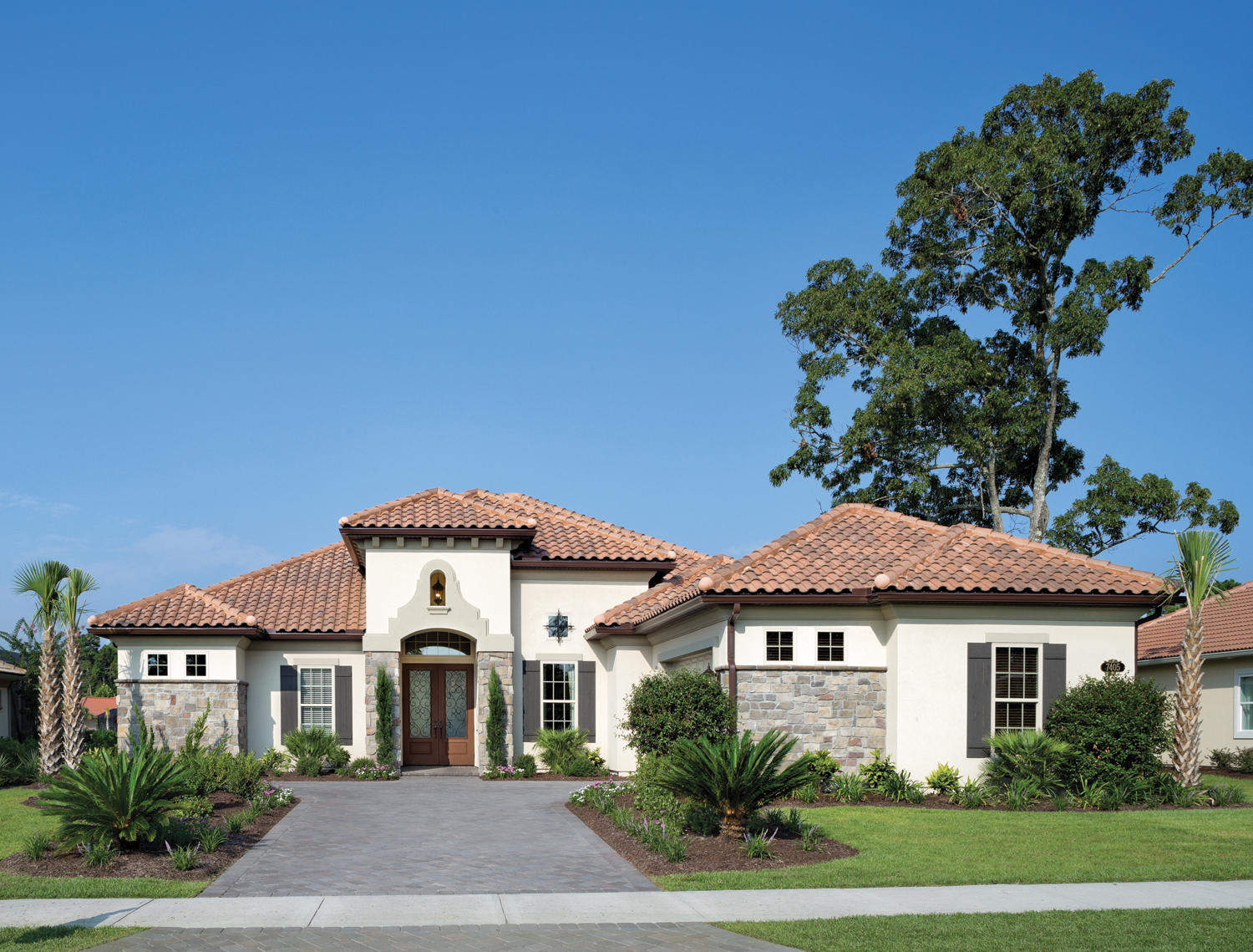 Designed by one of the most respected builders in the Southeastern US, this one story mediterranean style home will be the envy of your friends and neighbors. Concrete tile roof, stucco and stone exterior finsh with lush landscaping provides an inviting front elevation. The home borders the #11 tee box of the world famous Fred Couples designed golf course. The swimming pool and summer kitchen is great for outdoor entertaining. Wood and tile flooring throughout the main living areas. Custom built cabinetry and granite countertops in the kitchen and baths. 9-12' ceilings throughout. The lot is in Flood Zone ''X'', flood insurnace is not required. This home is a must see. Expected completion June, 2015.