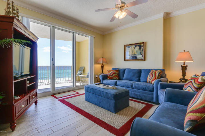 This beach inspired Gulf front 2/2 condo at Emerald Isle is the beach getaway you have always dreamed of! Perfect elevation within the stack! Riveting Gulf views are framed by immaculate interiors, designed with the Gulf of Mexico and sun in mind. Unit will convey fully furnished and rental ready! Meticulously maintained: Upgraded plank flooring throughout living area and kitchen! The gourmet kitchen features granite counters and loads of cabinet space and is fully stocked. This condo lives large and is spacious and bright! Master bedroom on the Gulf with access to the balcony through sliding glass doors. Gulf views from master bedroom, living room, dining area, & kitchen!