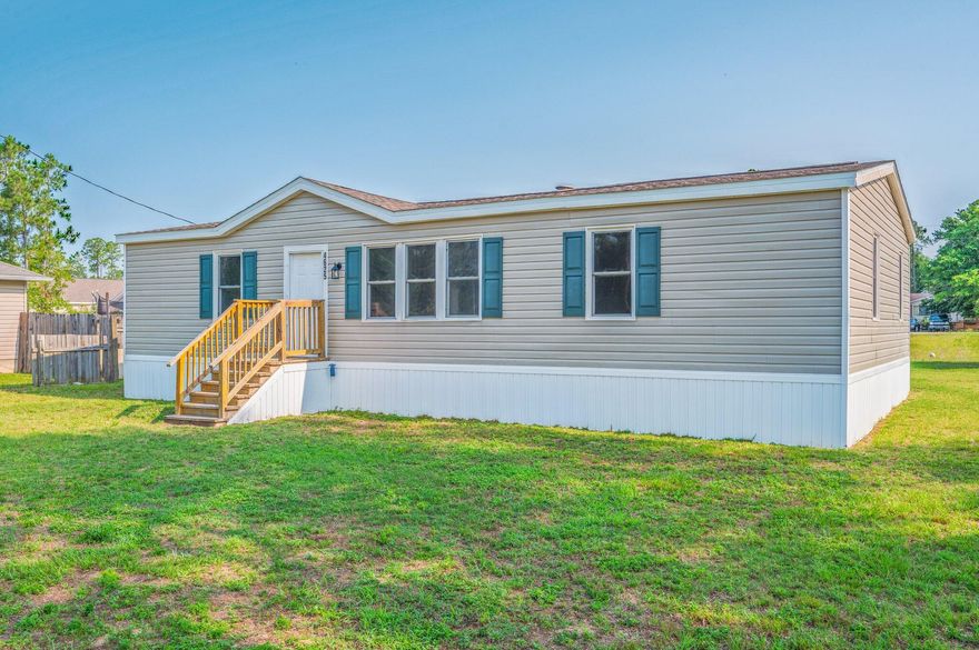 MOVE IN READY! 1987 Actual Age ~ with updates its Effective Age is 2022~ This updated home offers incredible value. Nestled on a spacious quarter-acre lot, the split floor plan features a large living area with a cozy wood-burning fireplace and a formal dining space. Step inside to find LVP flooring, orange peel wall texture and retextured ceilings. The kitchen boasts white painted cabinets, stainless appliances, upgraded counter tops and backsplash. Additional updates include updated light fixtures, newer guest tub surround, a resurfaced tub and shower in the master, new master vanity, new French doors and vinyl siding. New front and back deck complete with a yard building for all your storage needs. To top it all off...Brand New Shingled Roof, 2023 -WH 2022- HVAC 2022