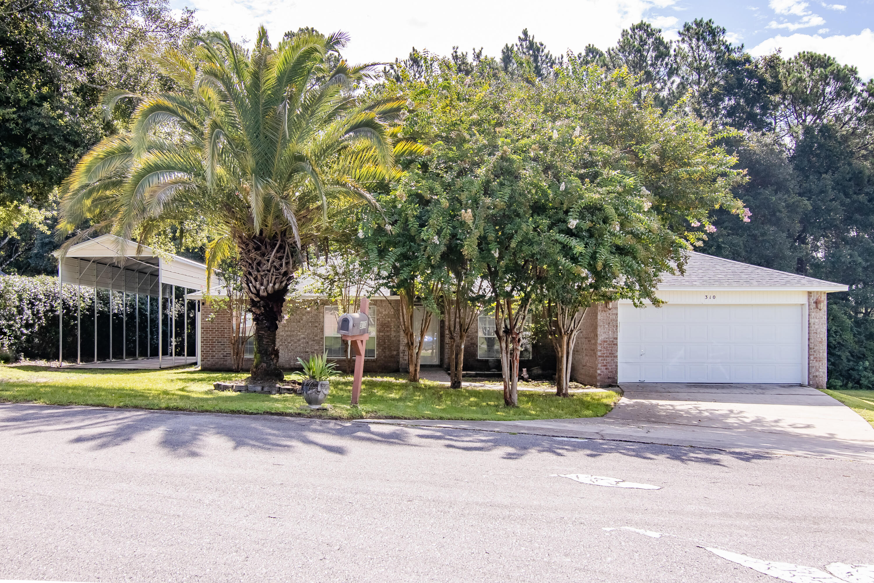 Located just MINUTES from town, this 4 bedroom 2 bath home could be the one you've been searching for in South Crestview! This spacious 1,900 square-foot home is uniquely positioned with the woods behind you and a retention pond to one side. Another unique feature is the 20ft. tall RV storage area, complete with its own 30 amp electrical hookup and a dump station for all of your out-of-town guests. Inside, the split floorplan offers a formal dining area, a wood-burning fireplace in the living room, a dine-in kitchen, and indoor laundry! Another great feature is that this home has NO CARPET! Avil. NOW! Schedule your showing today!