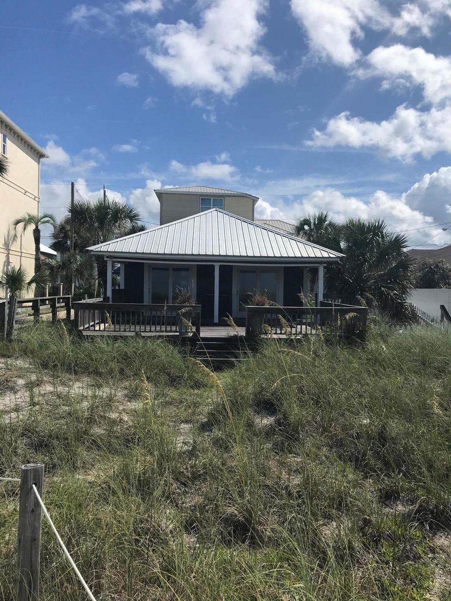 $100,000 PRICE REDUCTION!! Great opportunity to own beachfront property at an affordable price! Additional detached parking pad is included in the price.