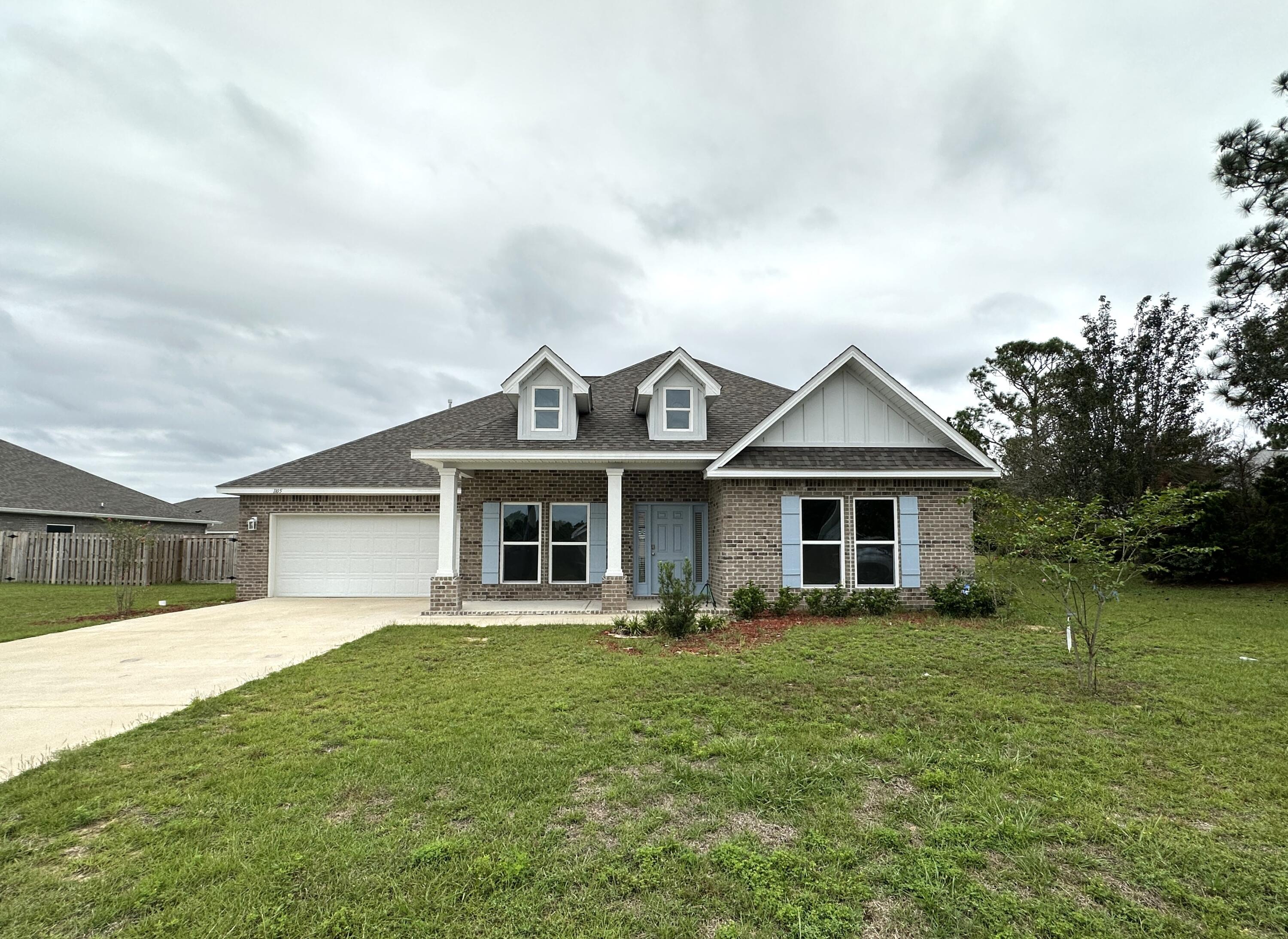 Beautiful, spacious, 5-bedroom home in one of Crestview's most desired locations! This home is about as far south as you can get in Crestview, with easy access to military bases and all points south, included the beach! It features a HUGE family area that is kitchen, living and dining rooms. The kitchen features a large island with lots of storage, white Shaker cabinets, granite countertops, stainless steel appliances and a gas stove. The home is light and bright with natural sunlight from the many windows and glass doors. There are plenty of storage areas and closets, LVP through the main house and carpet in the bedrooms. The master bath has double vanities, separate shower and garden tub, water closet and a huge walk-in closet. All this and there is also a formal dining room and a bonus