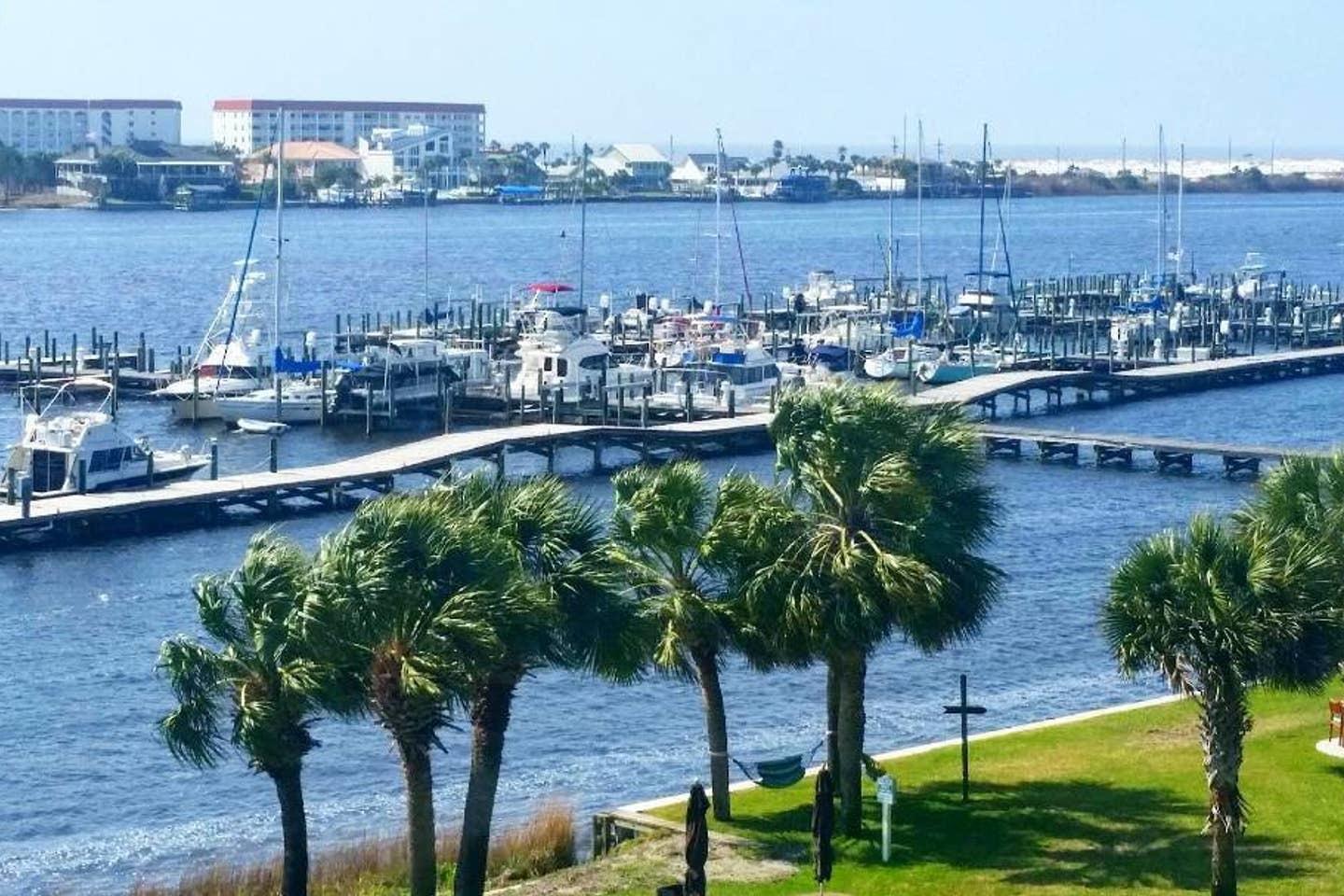 BEAUTIFUL VIEW OF INTERCOASTAL FROM THIS 4TH FLOOR UNIT. 40' SLIP COMES WITH THIS SOFTLY DECORATED (PASTELS) CLEAN & NEAT CONDO. GREAT INVESTMENT OR A PLACE TO CALL HOME. OWNERS ARE MOVING TO THE MOUNTAINS FOR A CHANGE OF PACE.